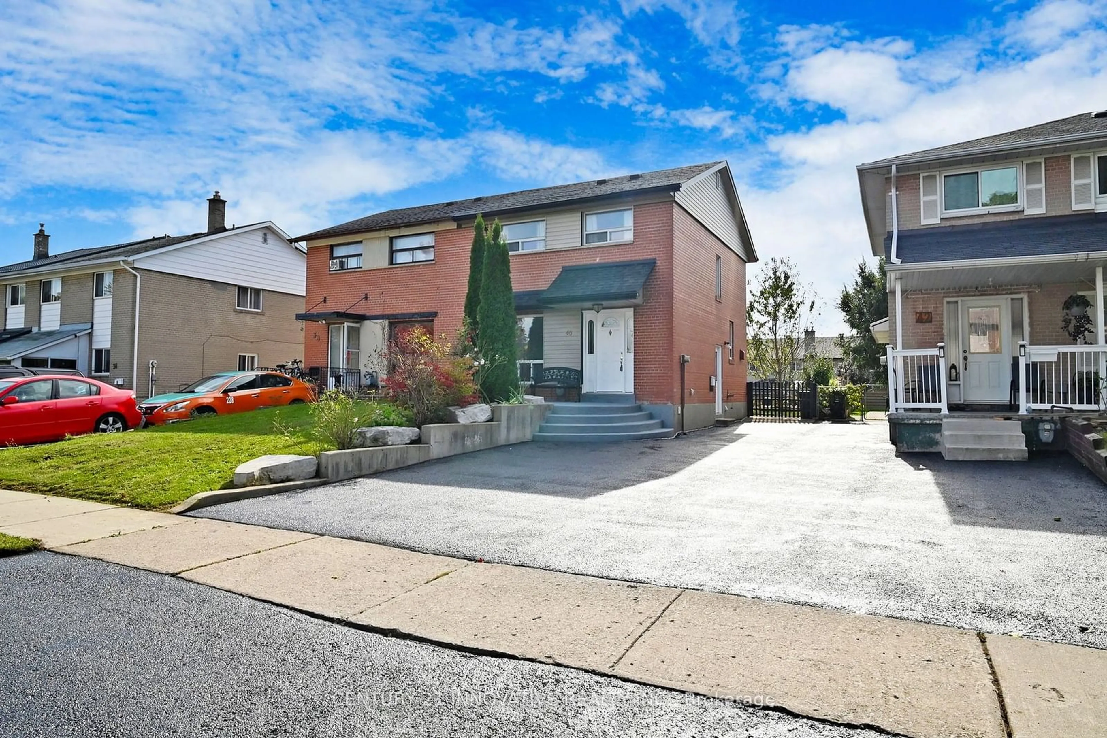 Frontside or backside of a home, the street view for 40 Radwinter Dr, Toronto Ontario M9V 1P8