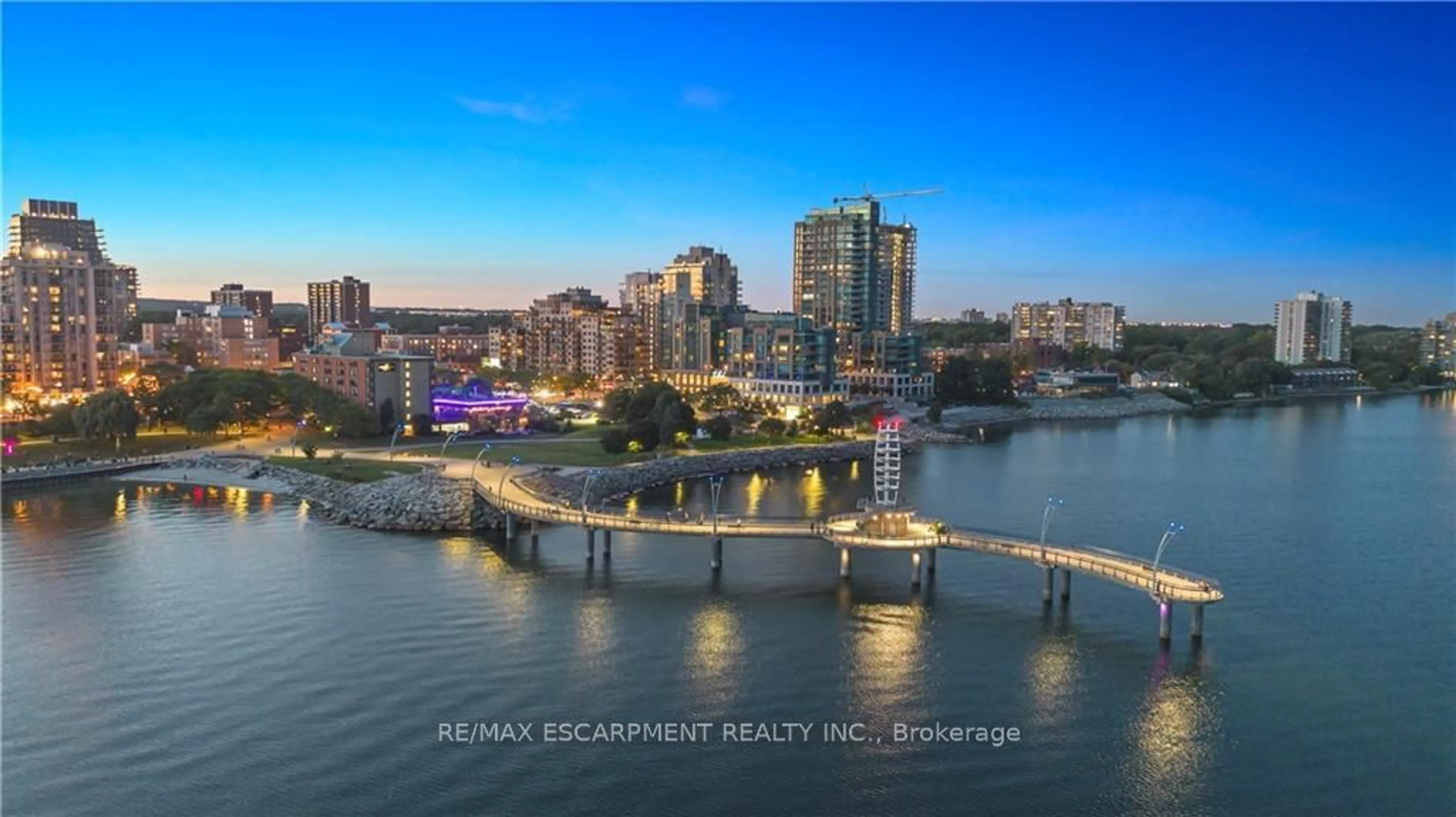 A pic from exterior of the house or condo, the view of city buildings for 2060 Lakeshore Rd #406, Burlington Ontario L7R 0G2