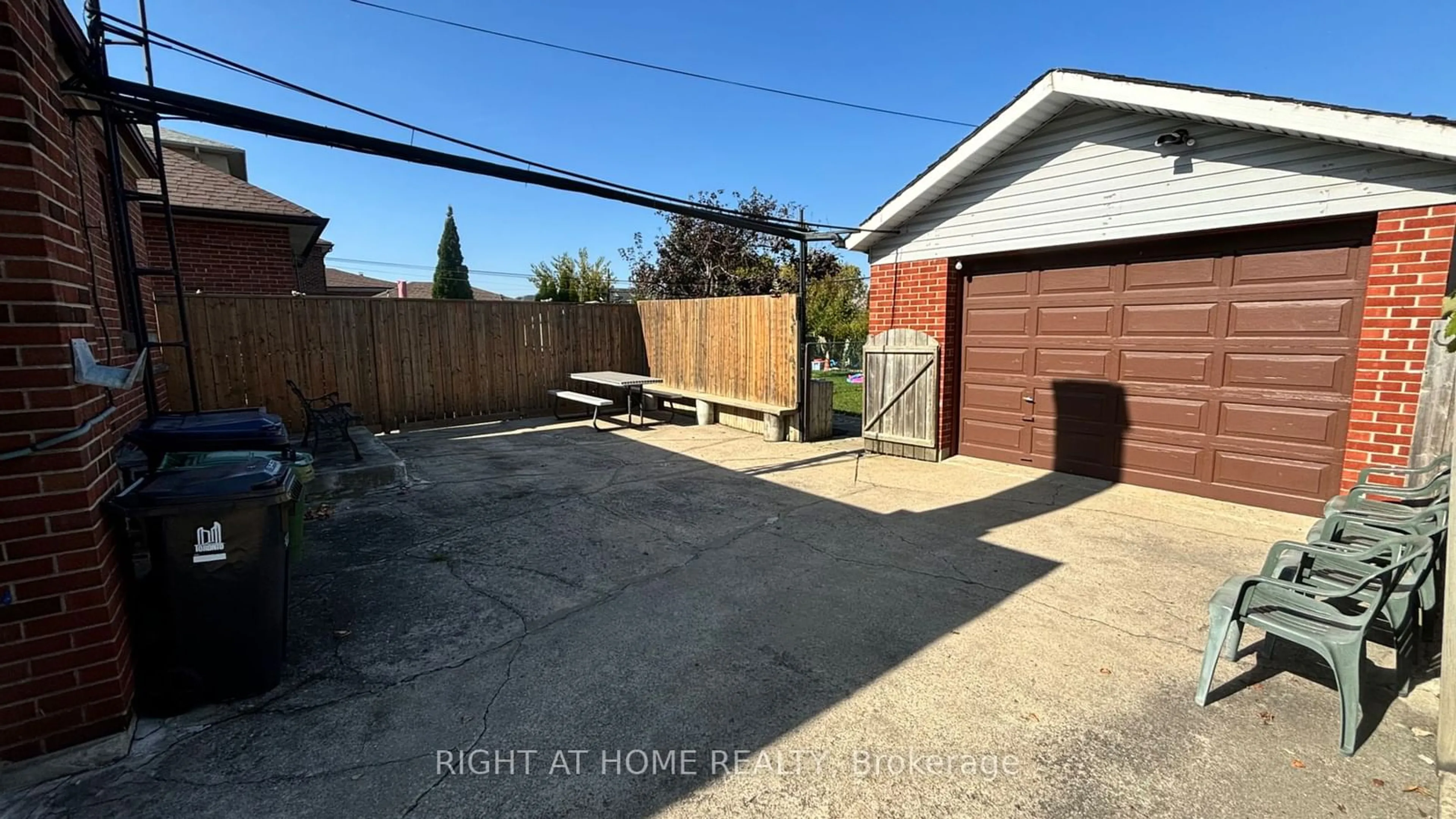 Frontside or backside of a home, the fenced backyard for 524 Glen Park Ave, Toronto Ontario M6B 2G3