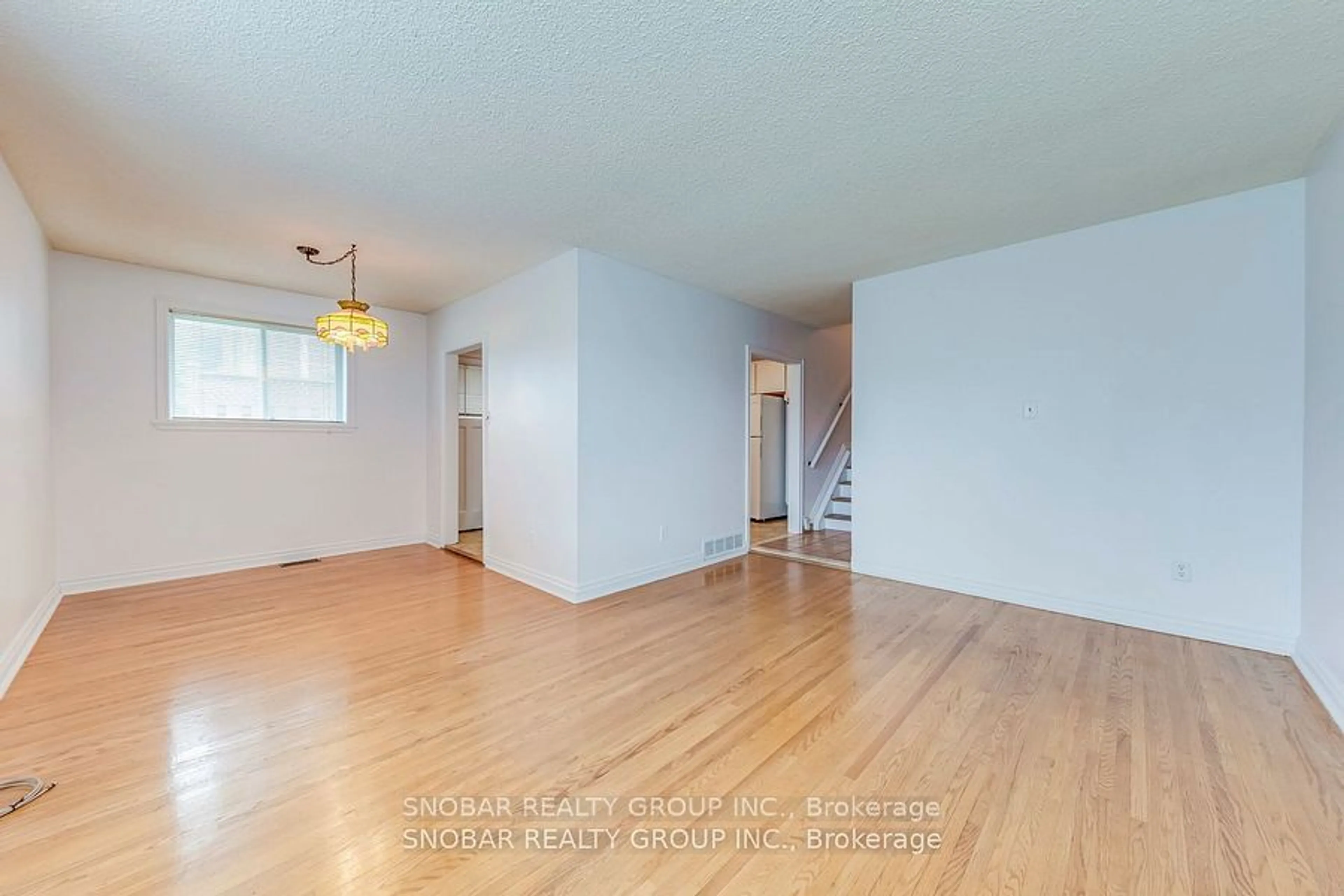 A pic of a room, wood floors for 45 Taysham Cres, Toronto Ontario M9V 1X1