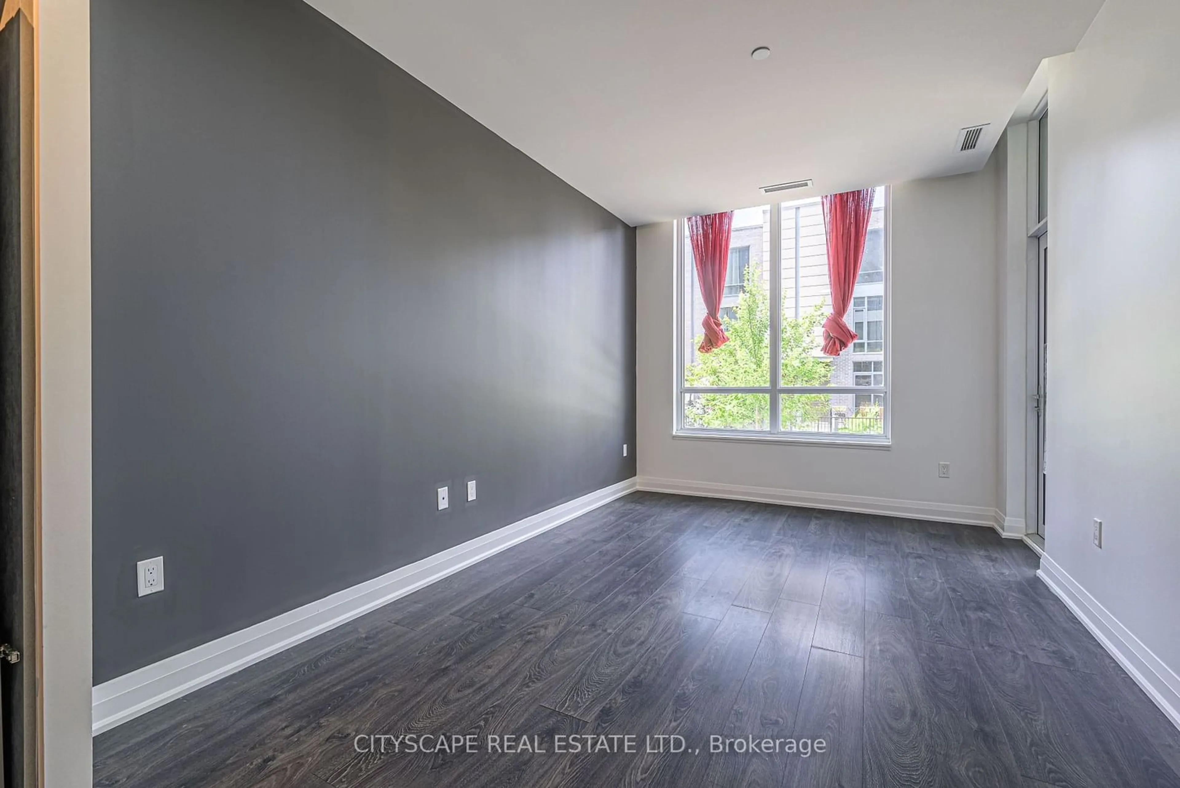 A pic of a room, wood floors for 26 Gibbs Rd #207, Toronto Ontario M9B 0E3