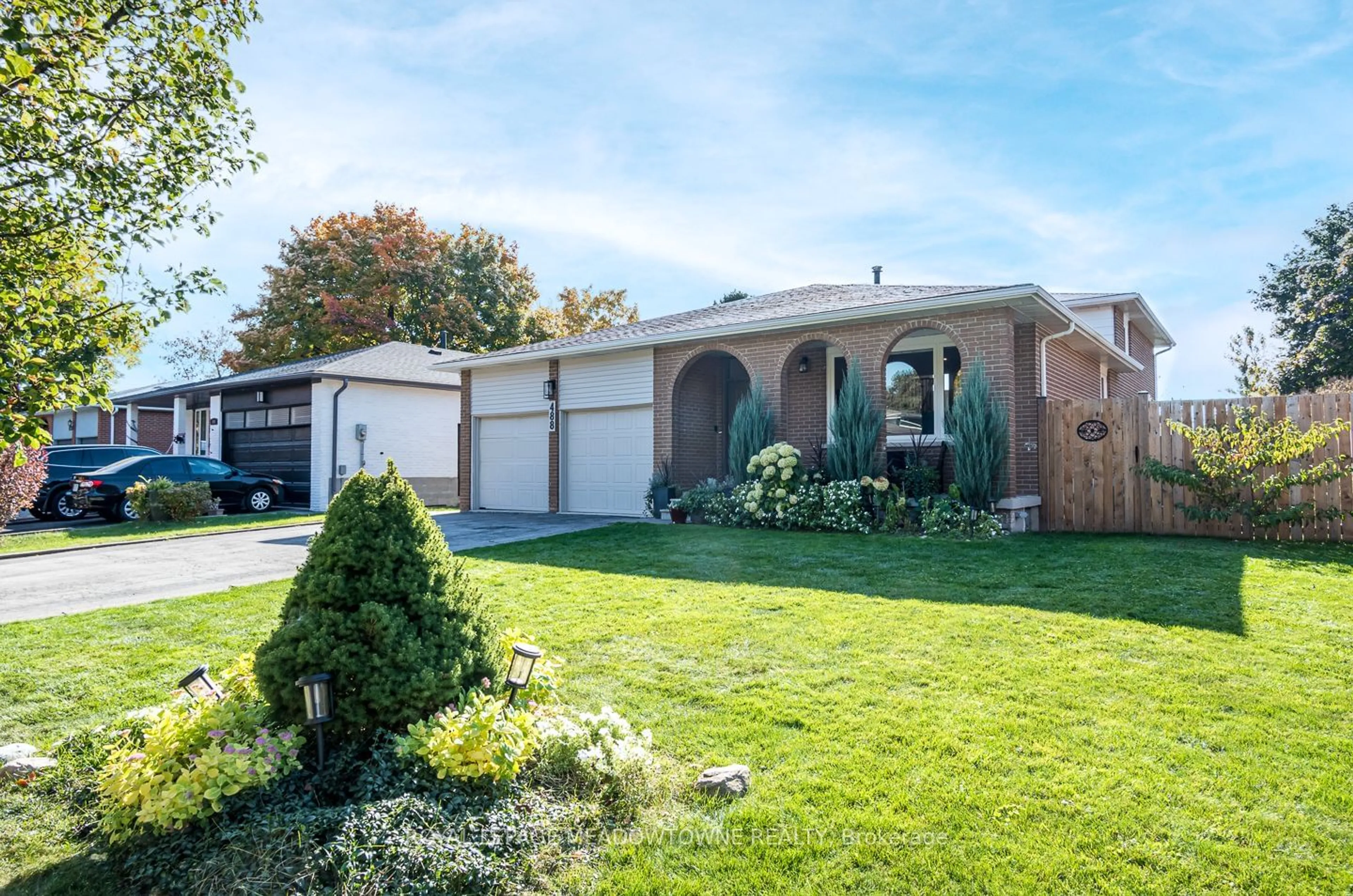 Frontside or backside of a home, the fenced backyard for 488 Valleyview Cres, Milton Ontario L9T 3L2