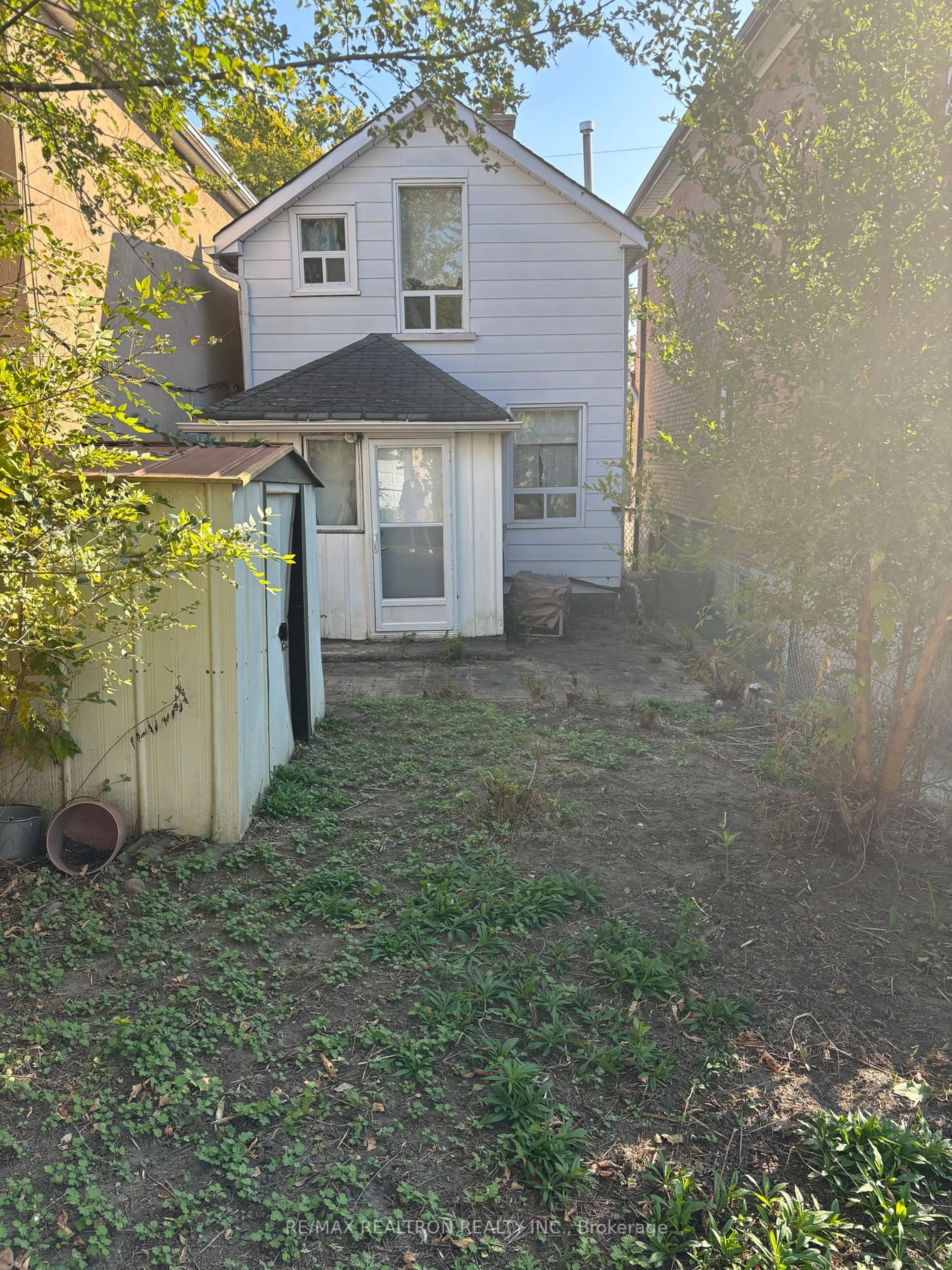 Frontside or backside of a home, the fenced backyard for 46 Pritchard Ave, Toronto Ontario M6N 1T3