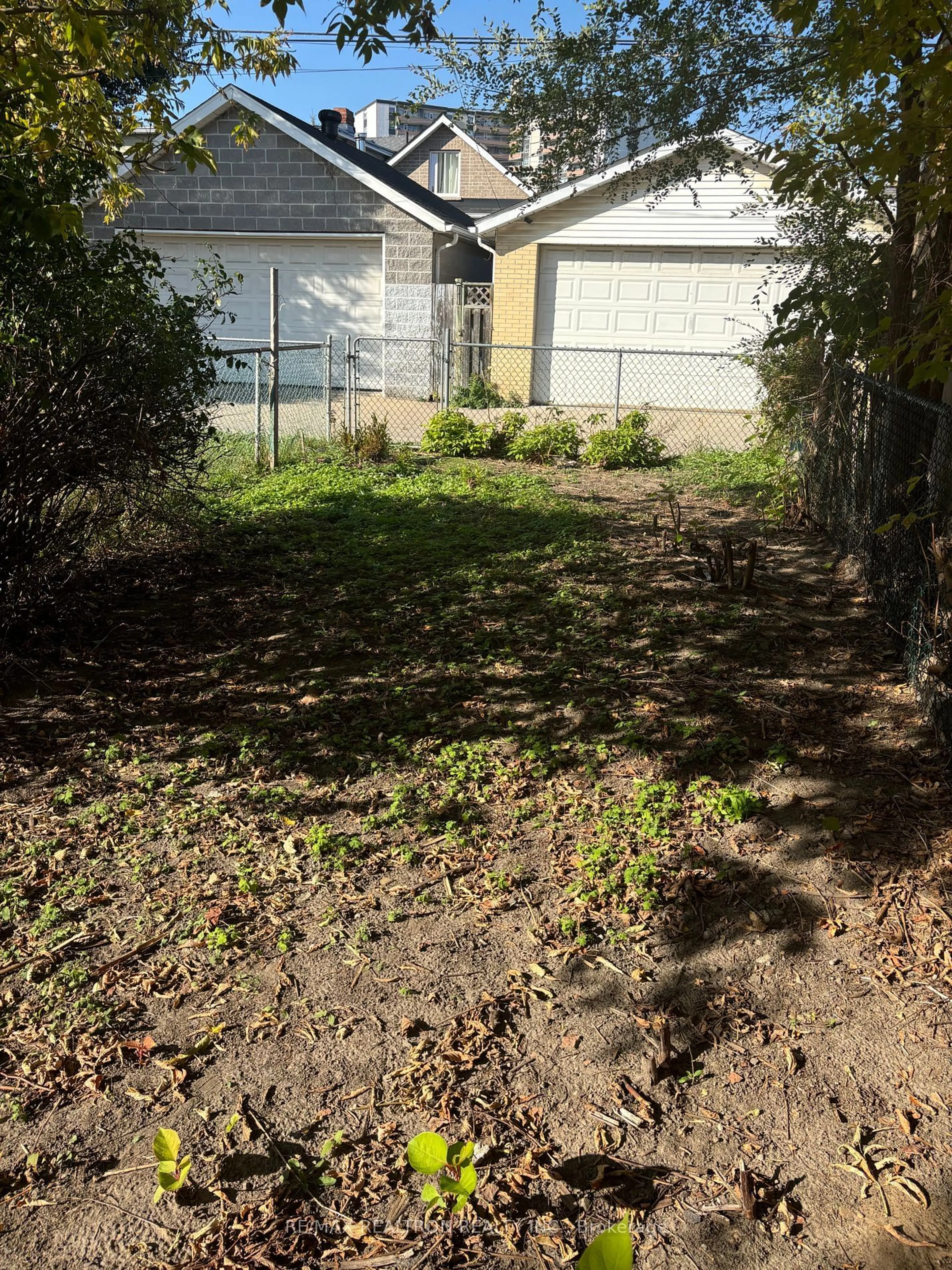 Frontside or backside of a home, the fenced backyard for 46 Pritchard Ave, Toronto Ontario M6N 1T3