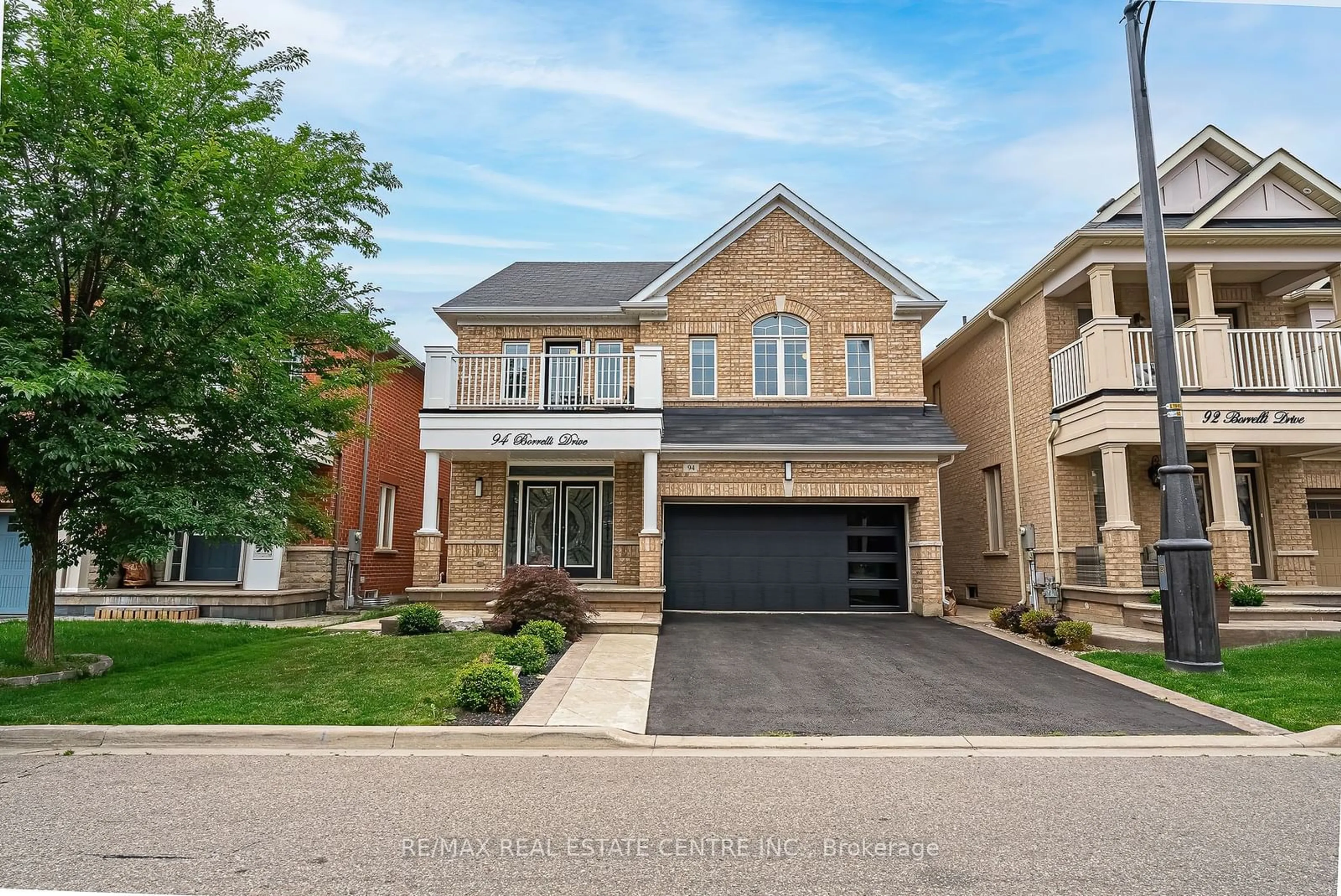 Home with brick exterior material for 94 Borrelli Dr, Brampton Ontario L6Y 5X1