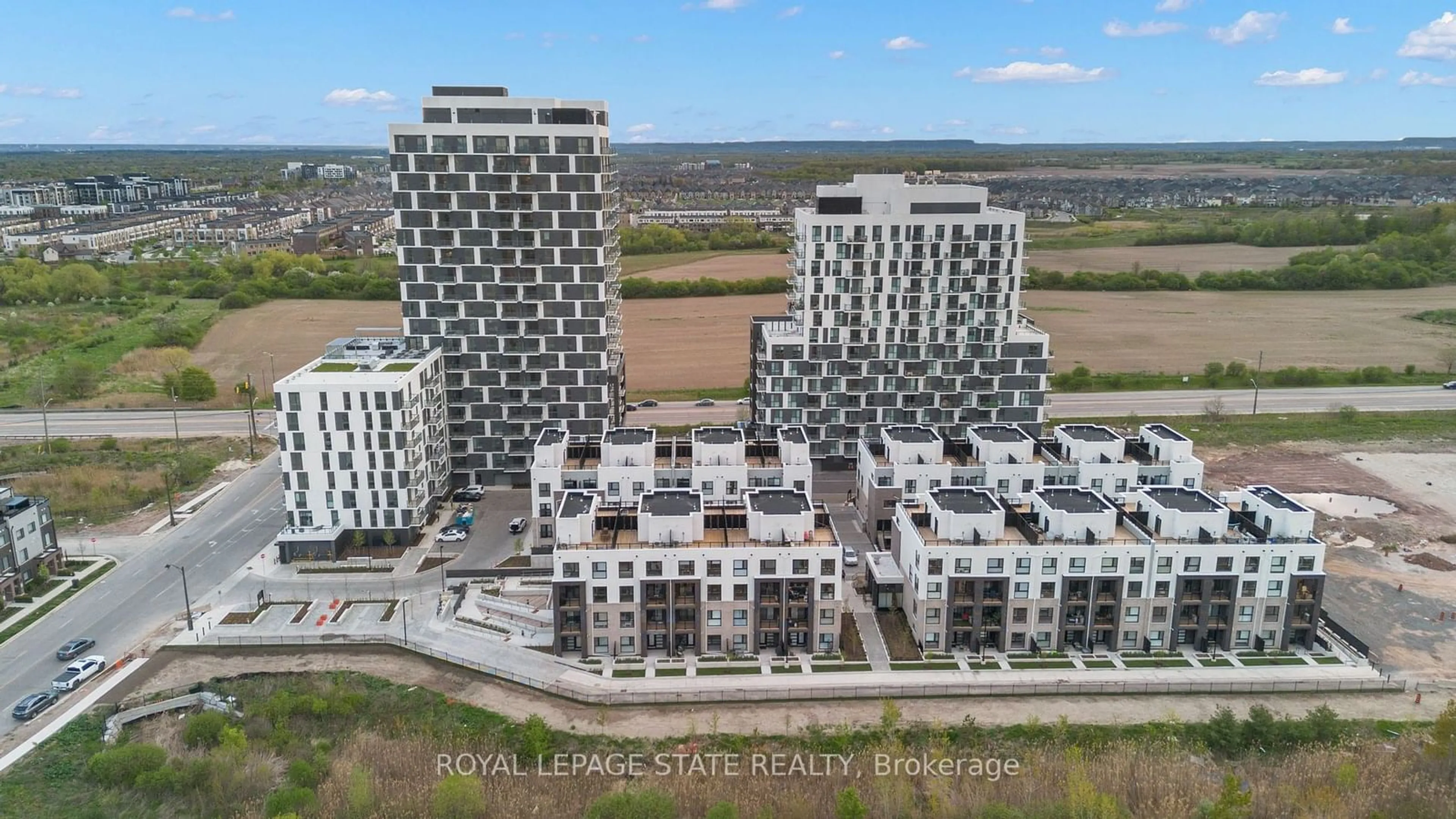 A pic from exterior of the house or condo, the view of city buildings for 335 Wheat Boom Dr #1604, Oakville Ontario L6H 7Y1