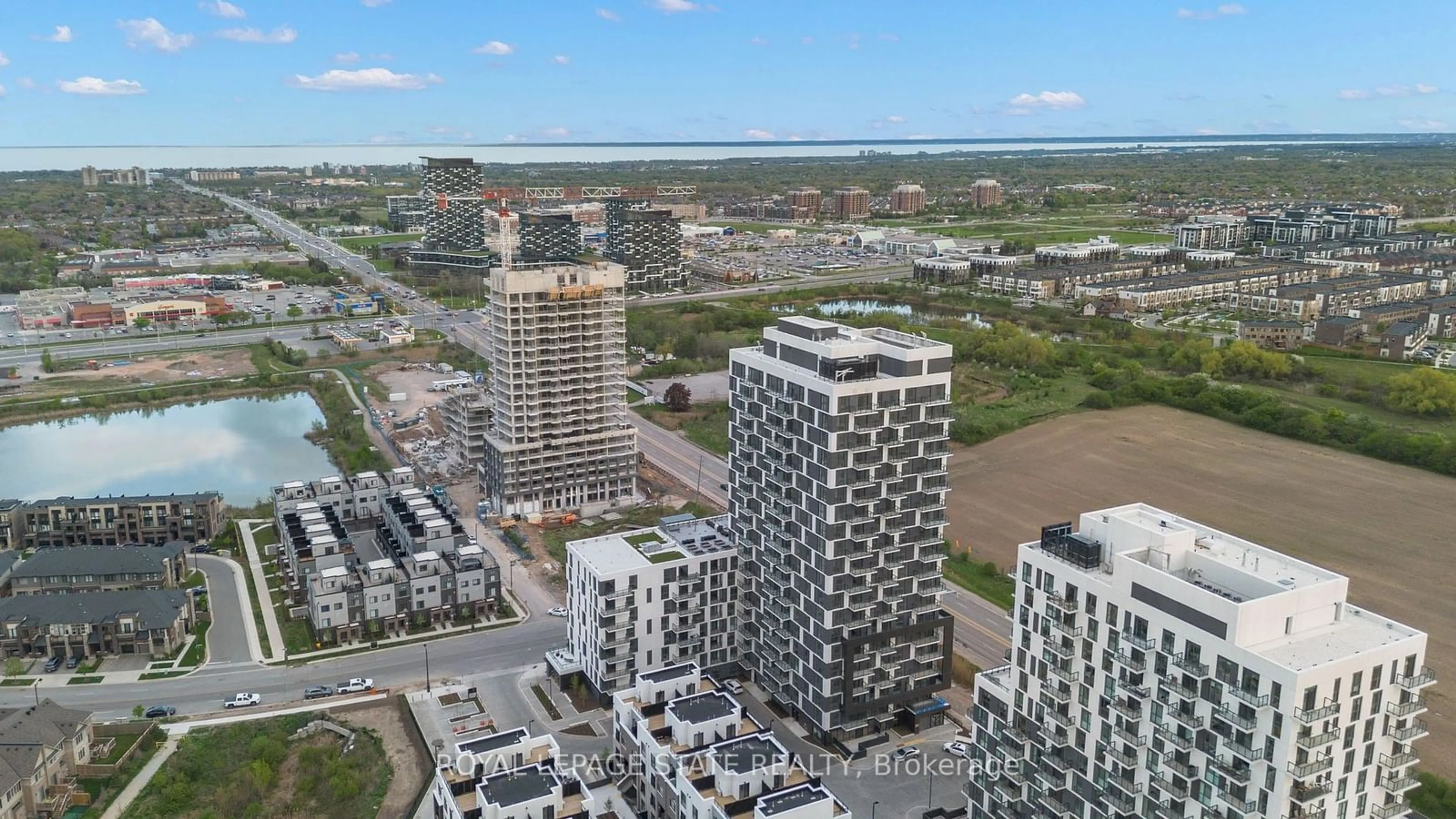 A pic from exterior of the house or condo, the view of city buildings for 335 Wheat Boom Dr #1604, Oakville Ontario L6H 7Y1