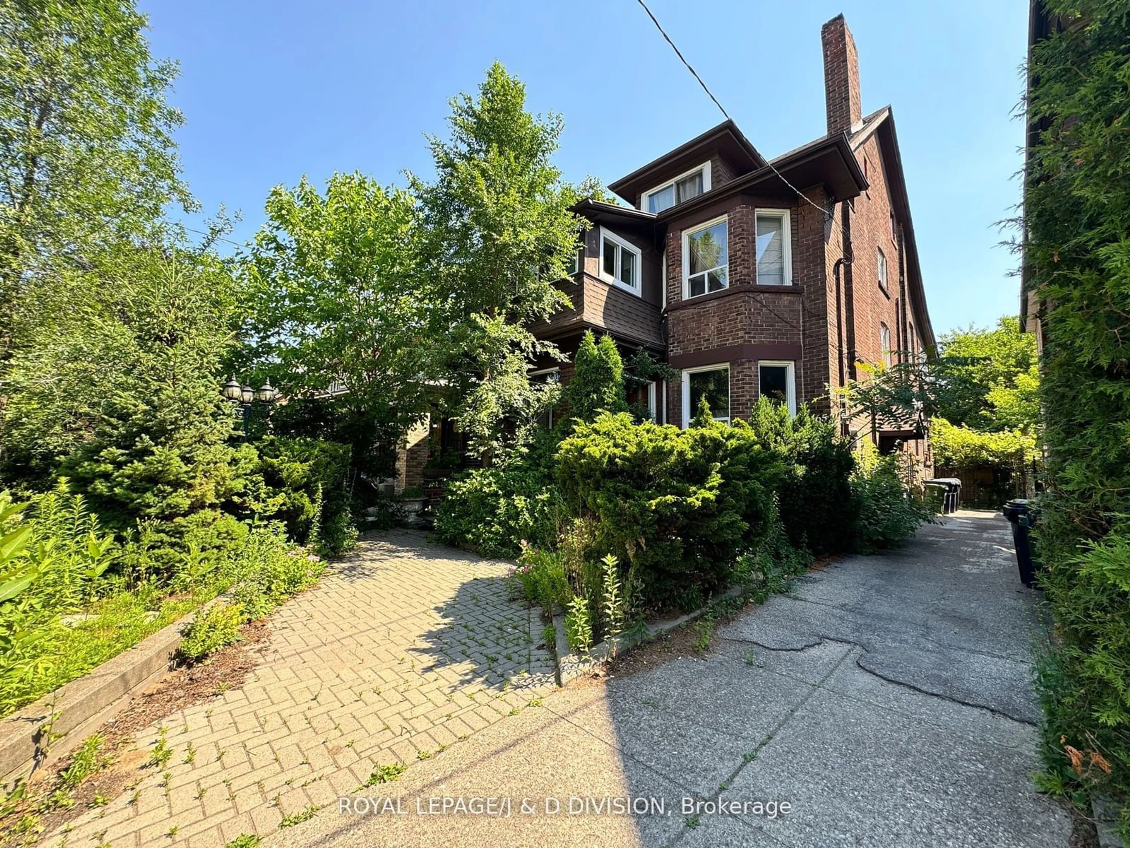 Frontside or backside of a home, the street view for 165 High Park Ave, Toronto Ontario M6P 2S3