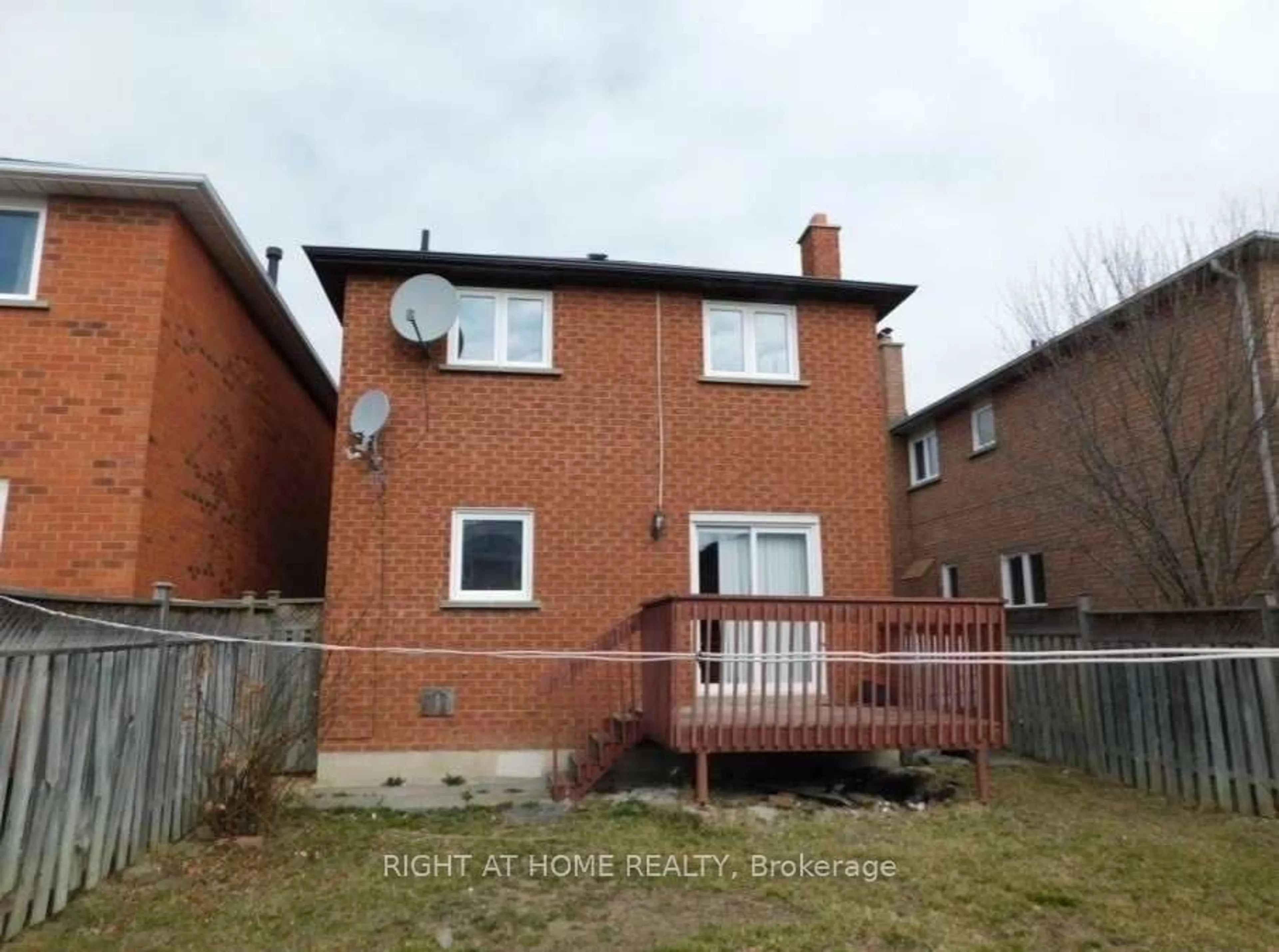 Frontside or backside of a home, the fenced backyard for 99 Michigan Ave, Brampton Ontario L6Y 4N6