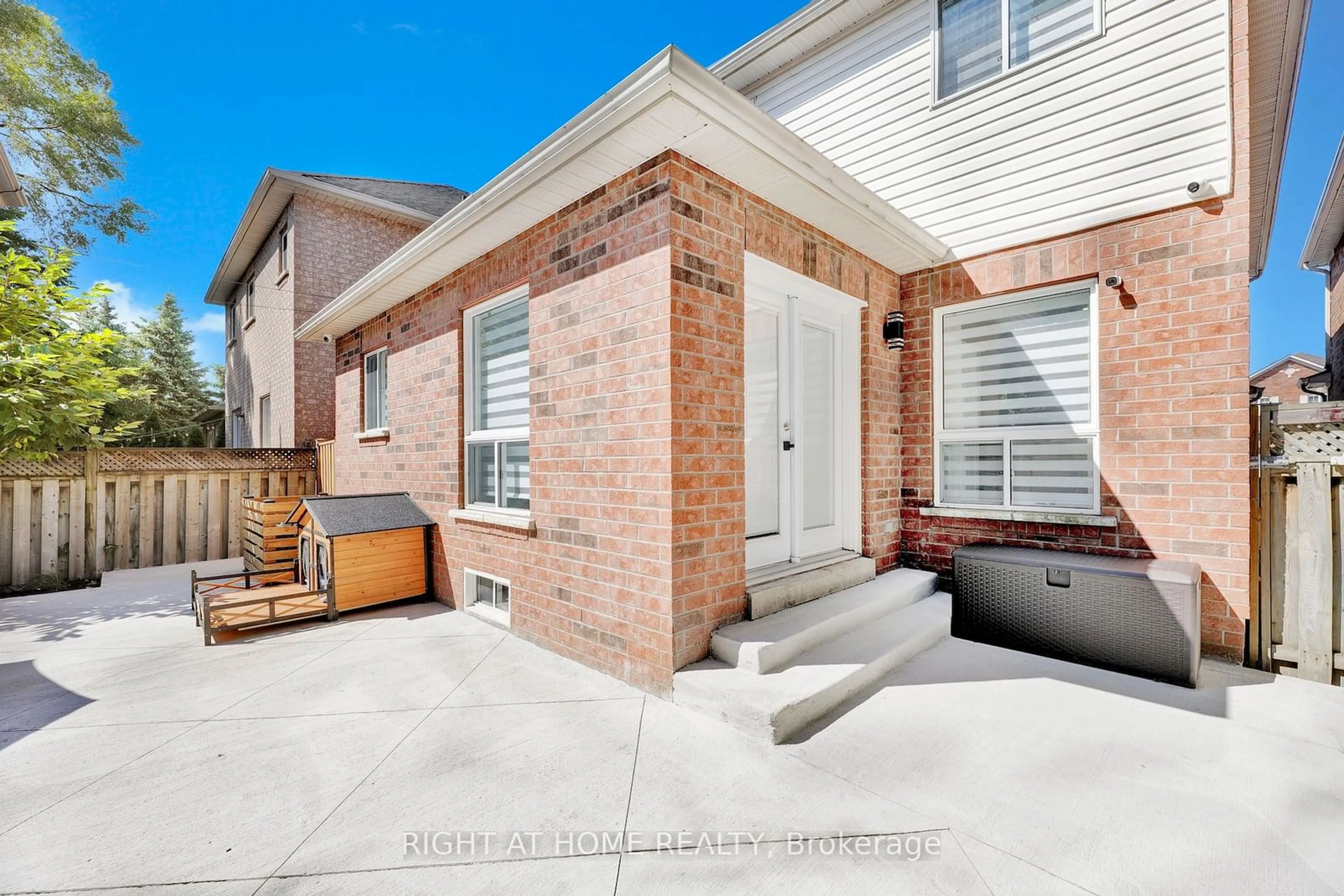 A pic from exterior of the house or condo, the fenced backyard for 13 Meadow Oak Pl, Toronto Ontario M9N 3Z4