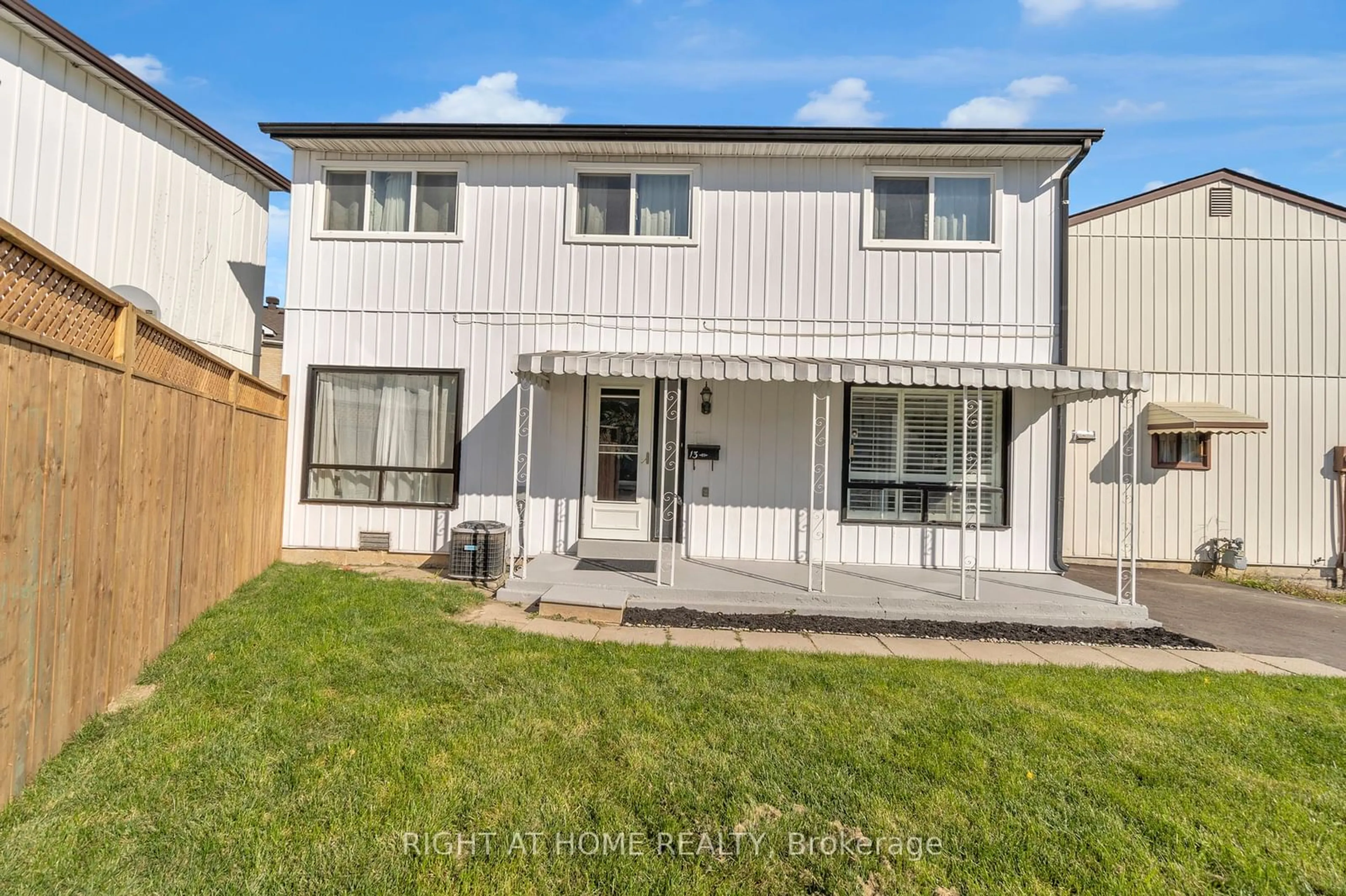 Frontside or backside of a home, the fenced backyard for 13 Huntingwood Cres, Brampton Ontario L6S 1S5