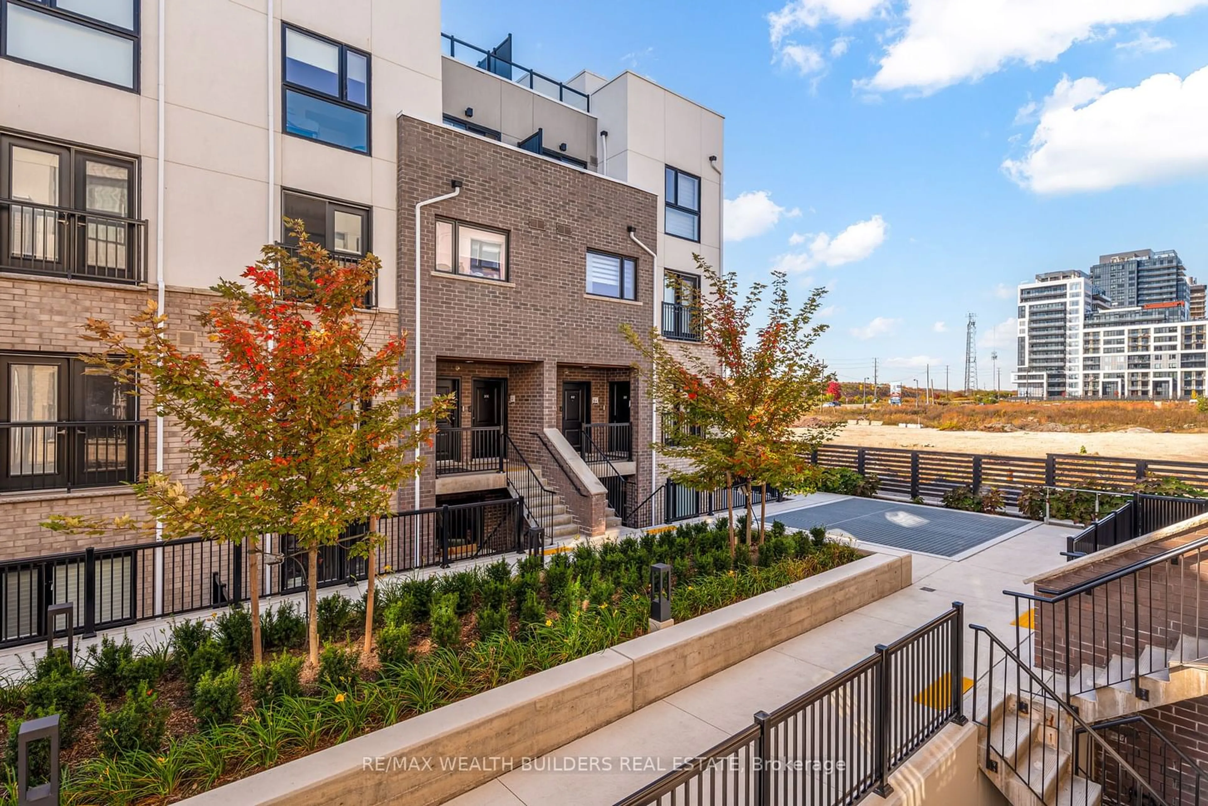 A pic from exterior of the house or condo, the front or back of building for 349 Wheat Boom Dr #205, Oakville Ontario L6H 7X5