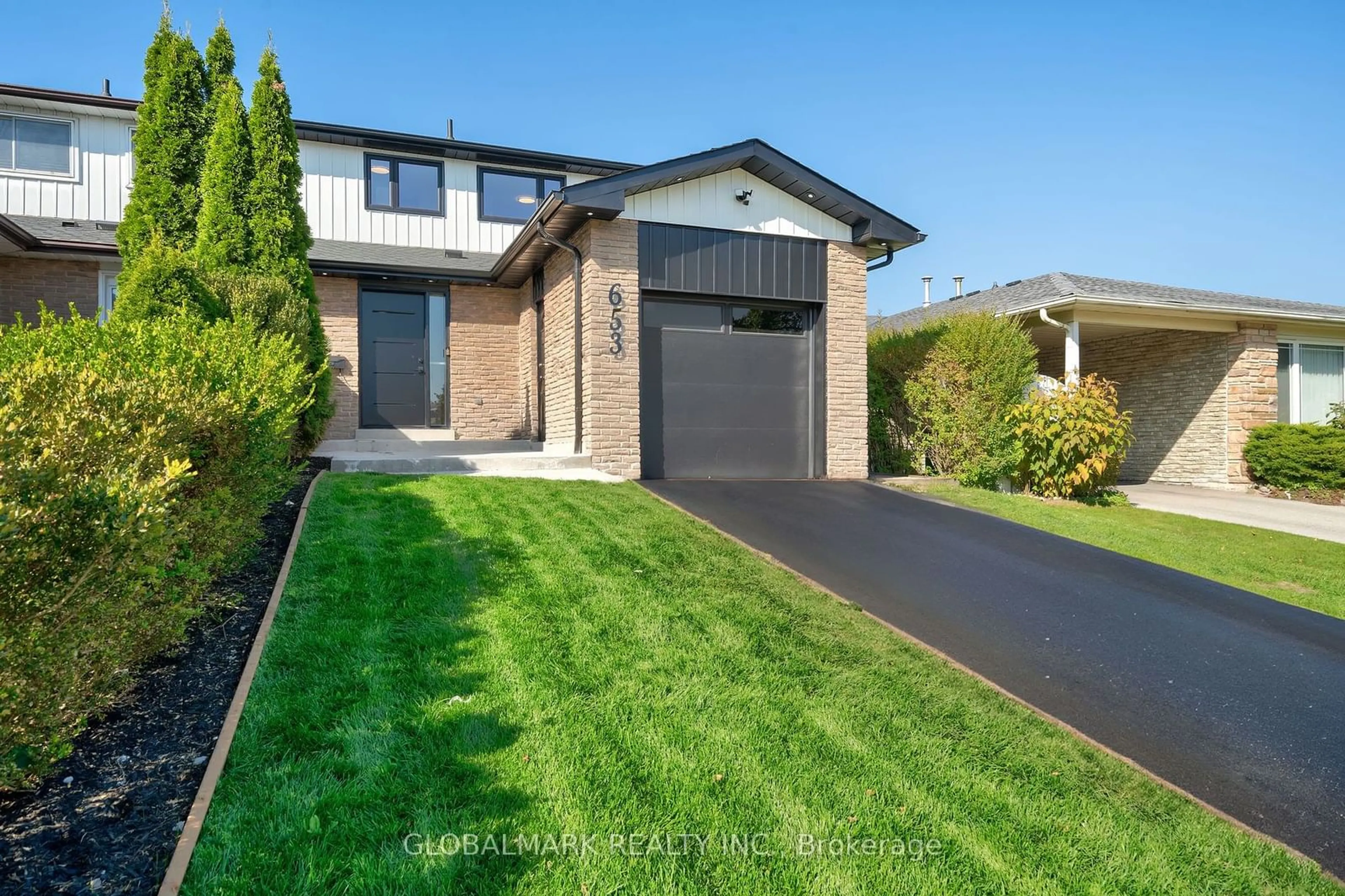 Frontside or backside of a home, the fenced backyard for 653 Dodsworth Cres, Mississauga Ontario L4Y 2H6