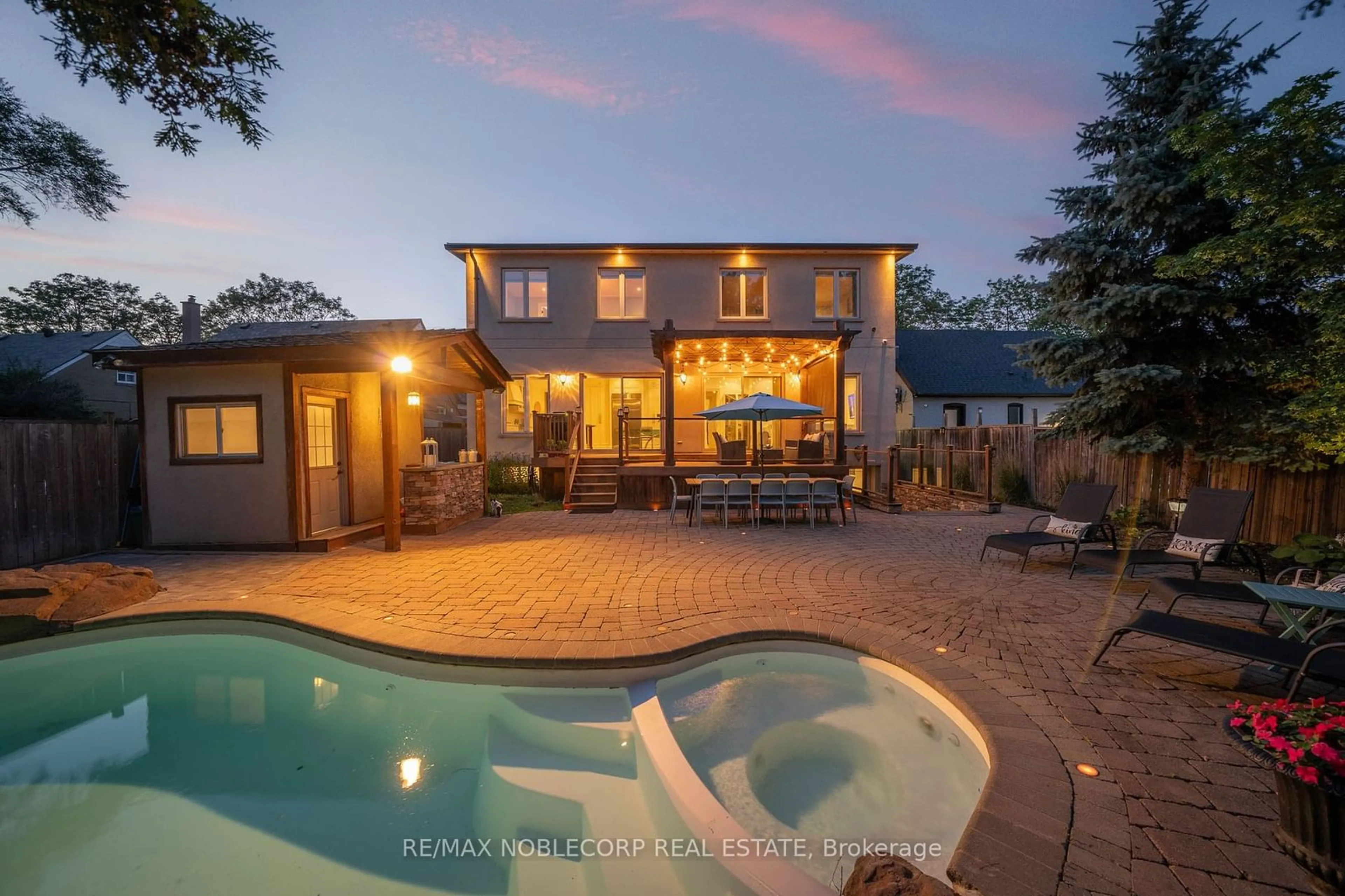 Frontside or backside of a home, the fenced backyard for 35 Yorkdale Cres, Toronto Ontario M9M 1C2