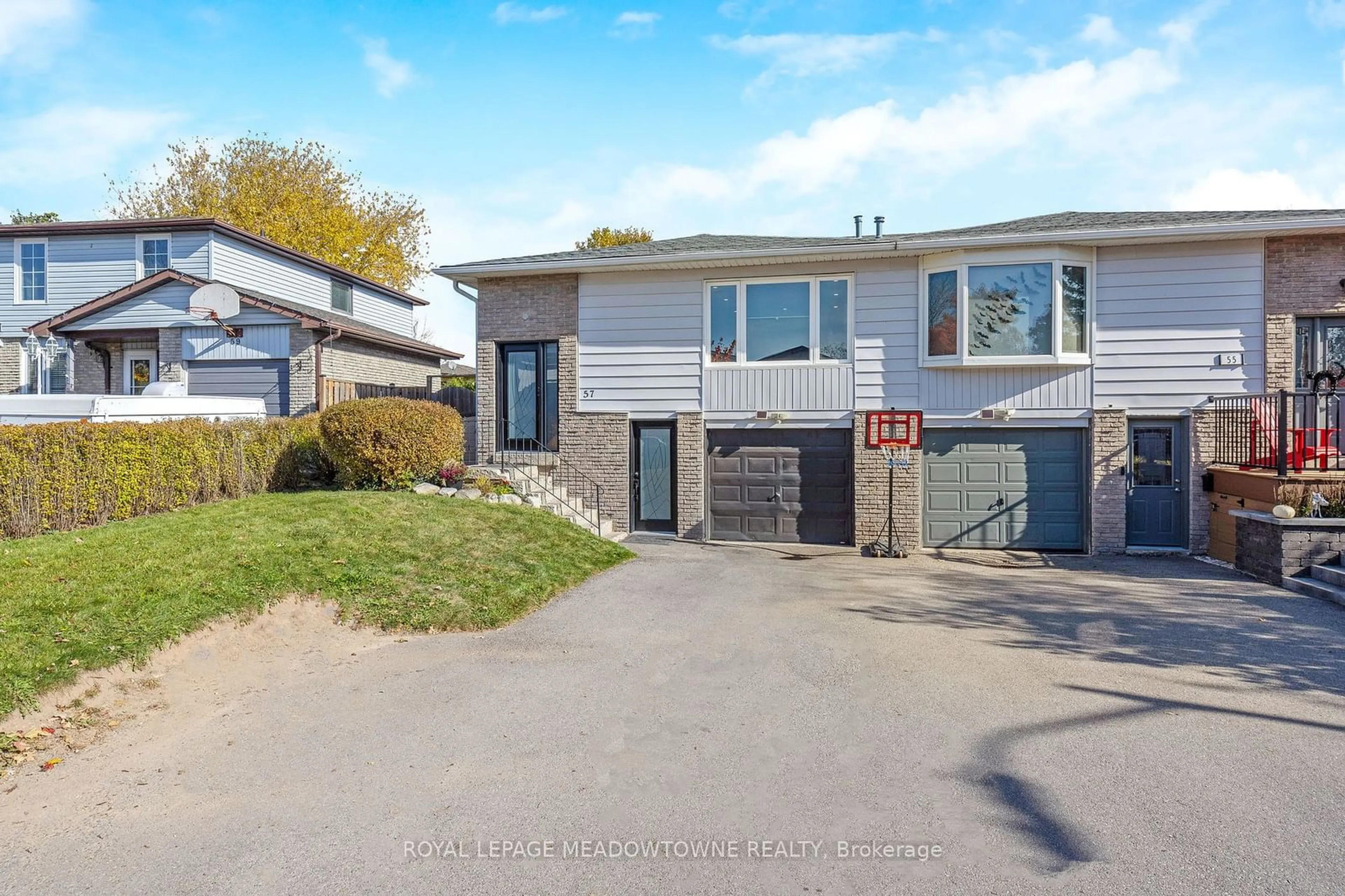 Frontside or backside of a home, the street view for 57 Greenore Cres, Halton Hills Ontario L7J 2T1