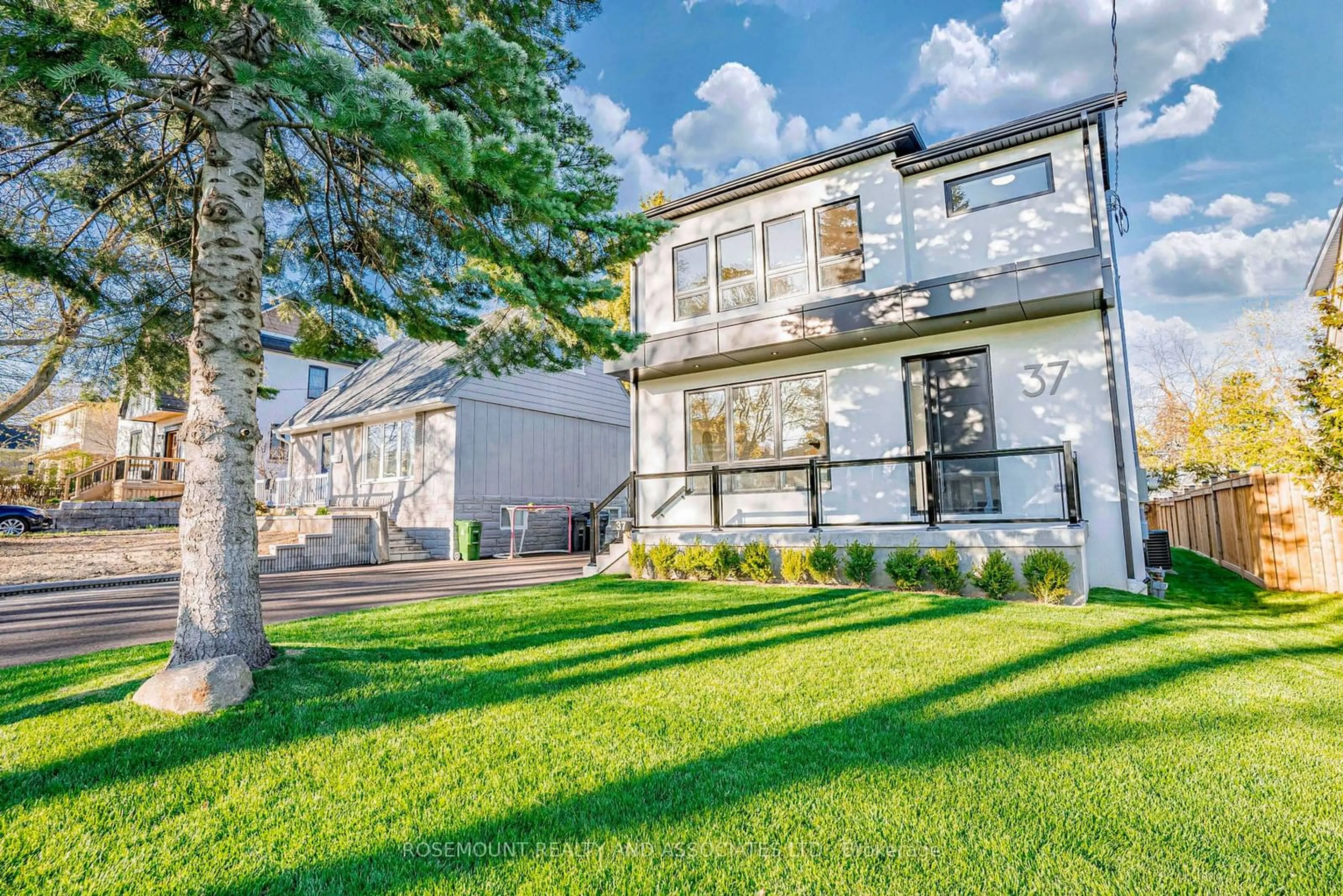 A pic from exterior of the house or condo, the fenced backyard for 37 Radlett Ave, Toronto Ontario M8W 4N1