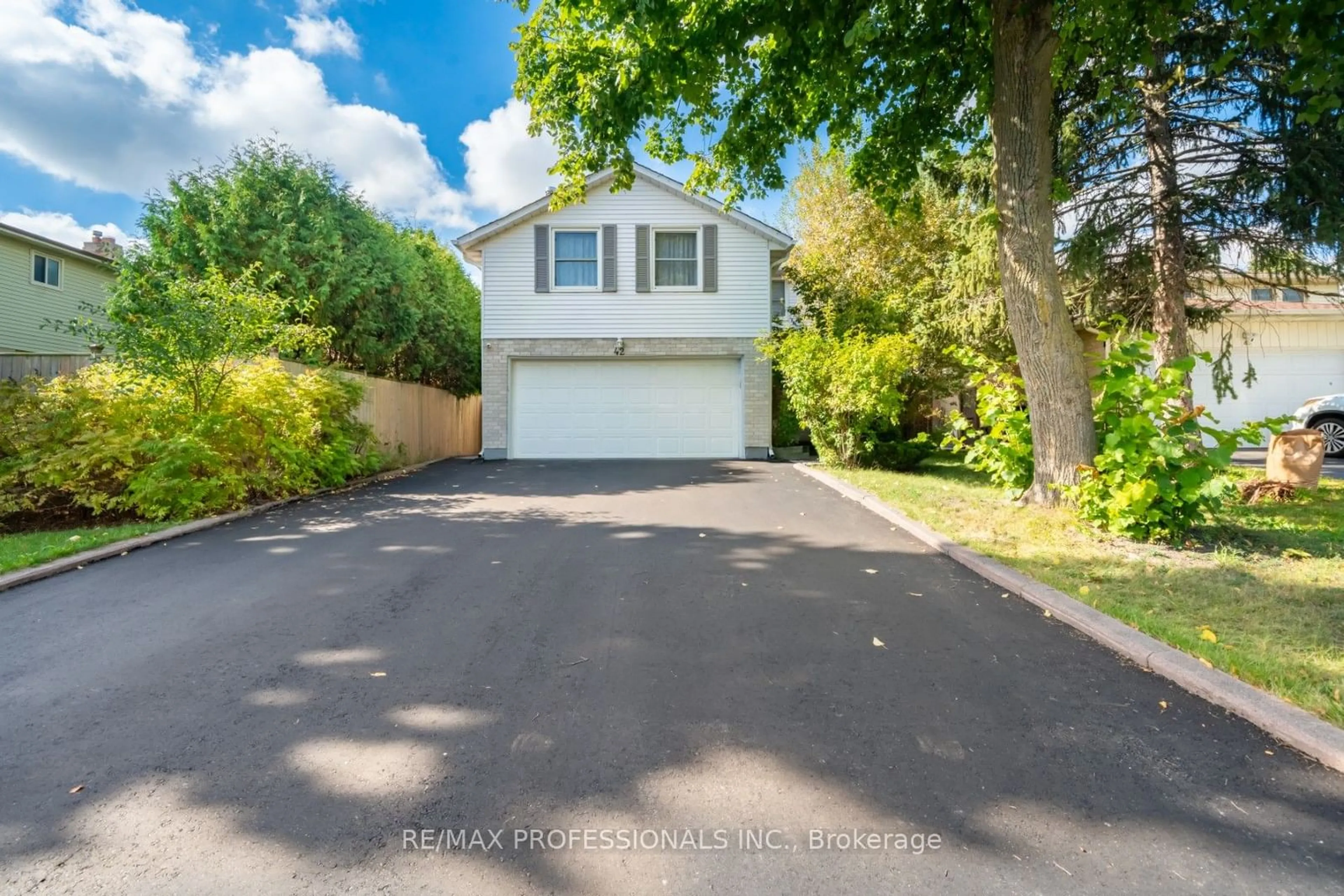 Frontside or backside of a home, the fenced backyard for 42 Reynier Dr, Brampton Ontario L6Z 1L7