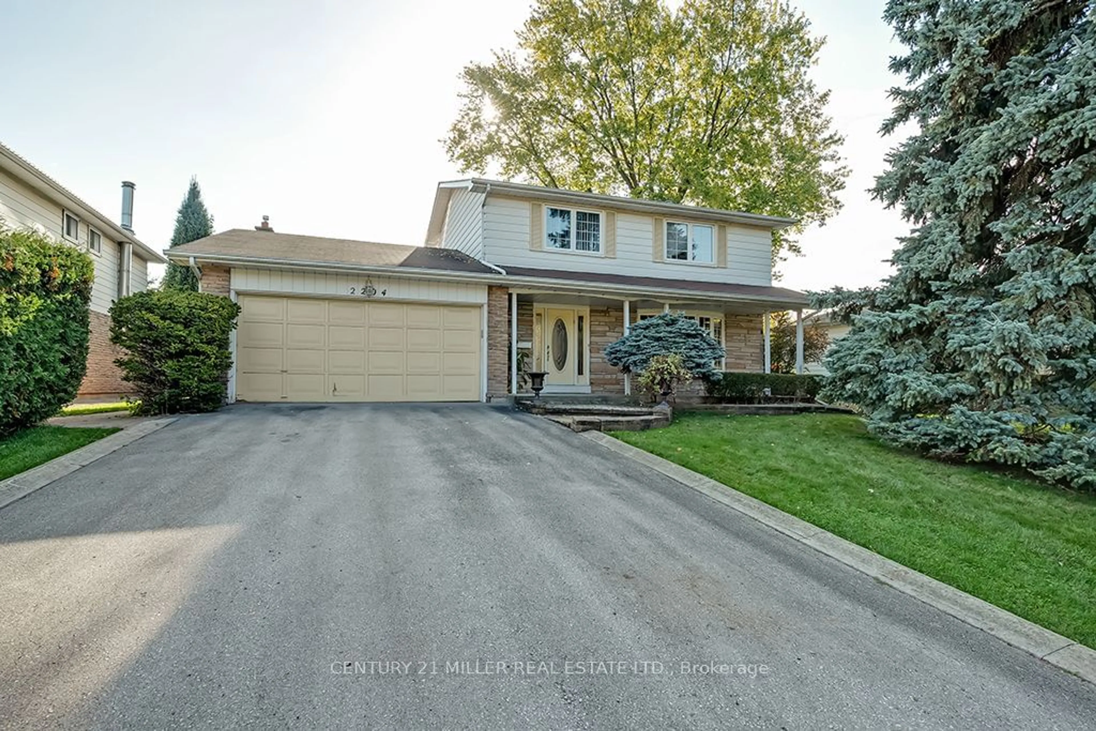 Frontside or backside of a home, the street view for 2204 Rebecca St, Oakville Ontario L6L 2A5