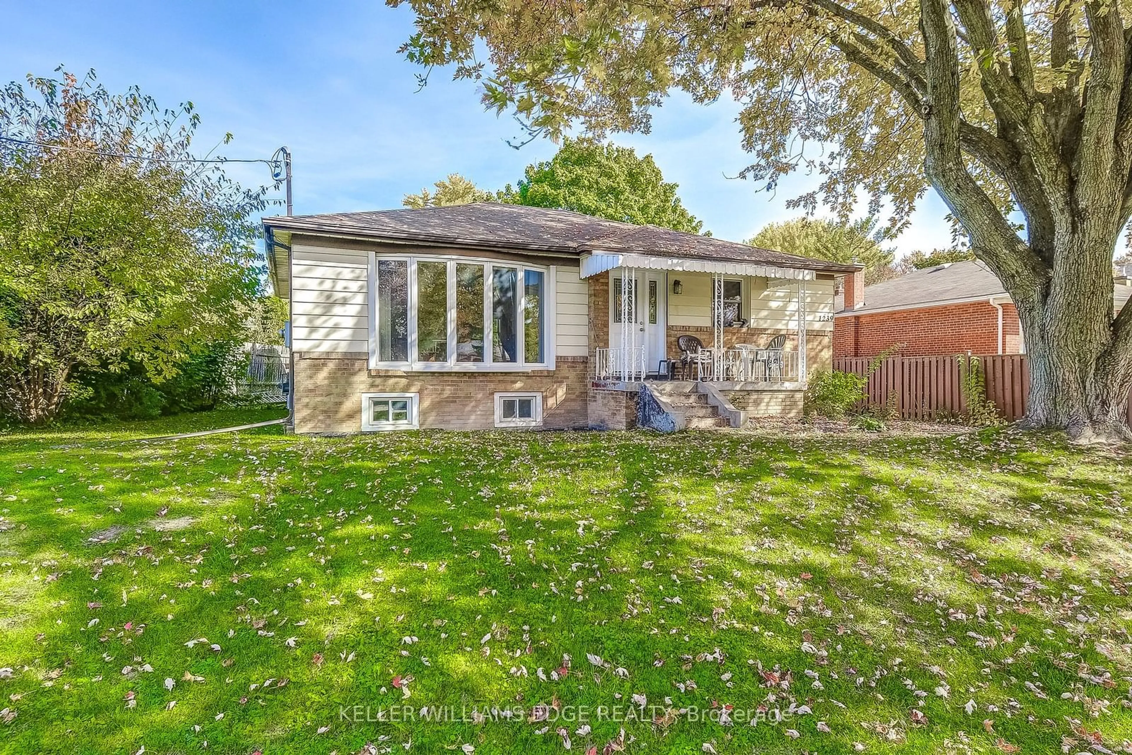 A pic from exterior of the house or condo, the fenced backyard for 1239 De Quincy Cres, Burlington Ontario L7P 1E2