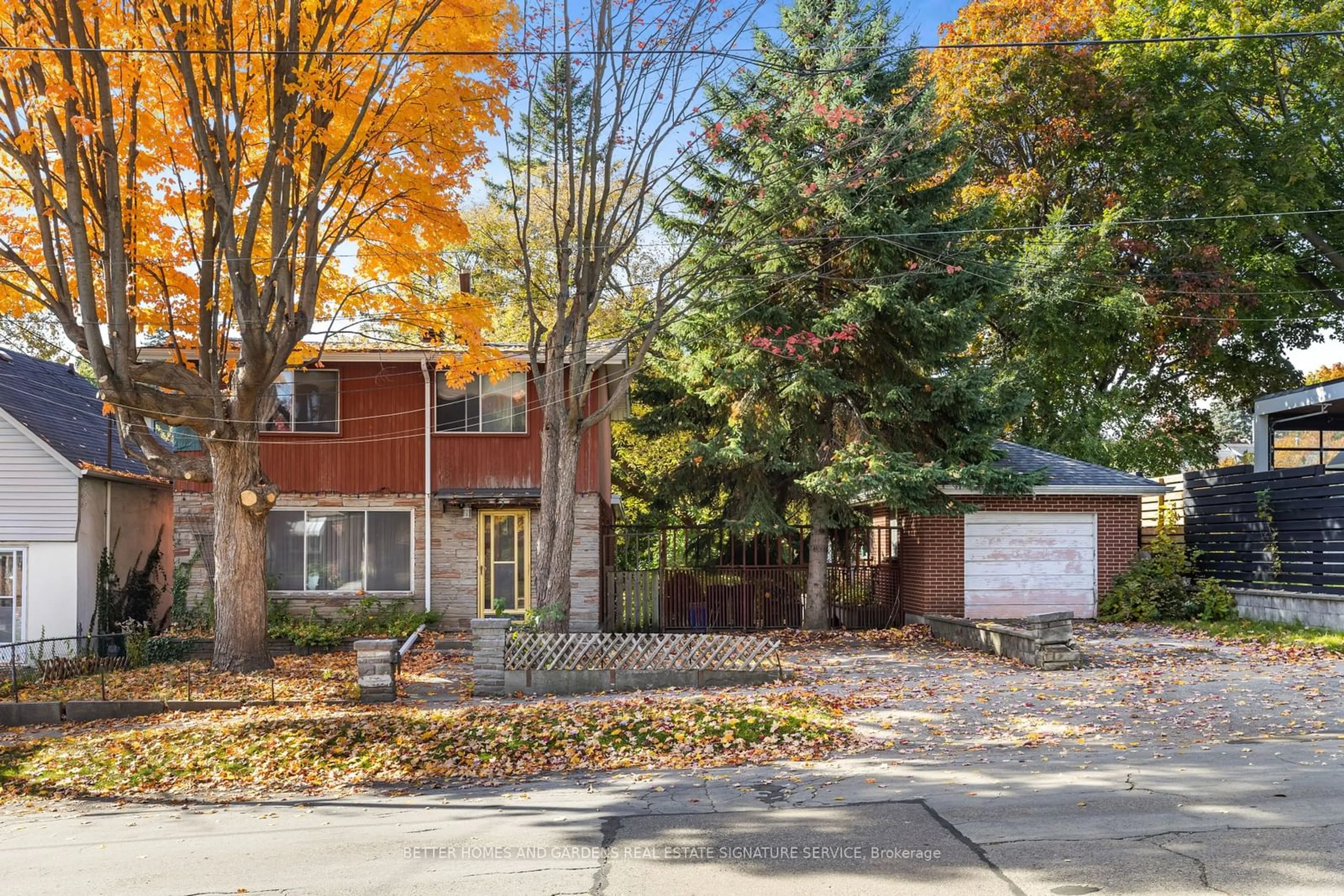 A pic from exterior of the house or condo, the fenced backyard for 30 McIntosh Ave, Toronto Ontario M8Y 3E2