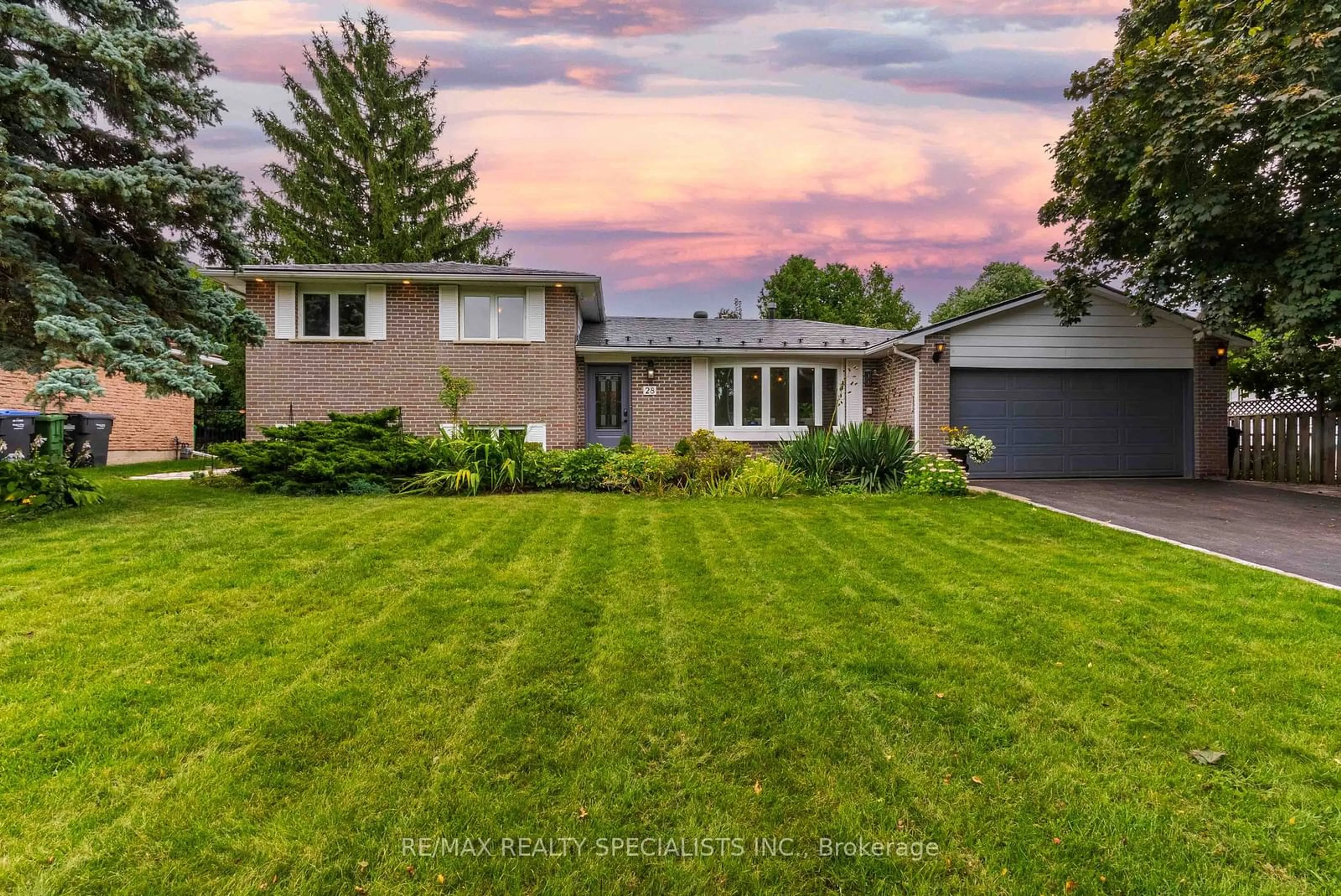 Frontside or backside of a home, the fenced backyard for 28 Larry St, Caledon Ontario L7C 1K8