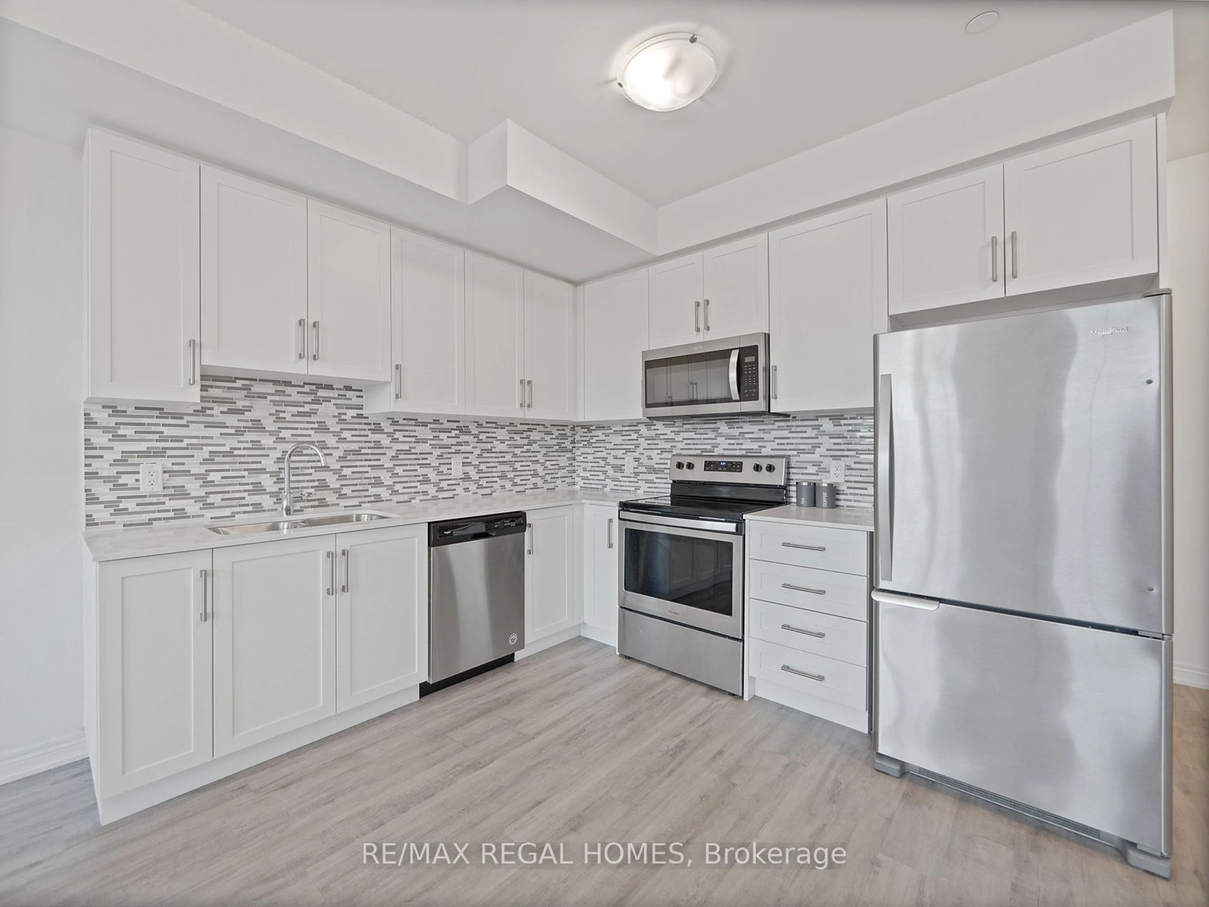 Standard kitchen, wood floors for 2205 Lillykin St #3, Oakville Ontario L6H 7H2