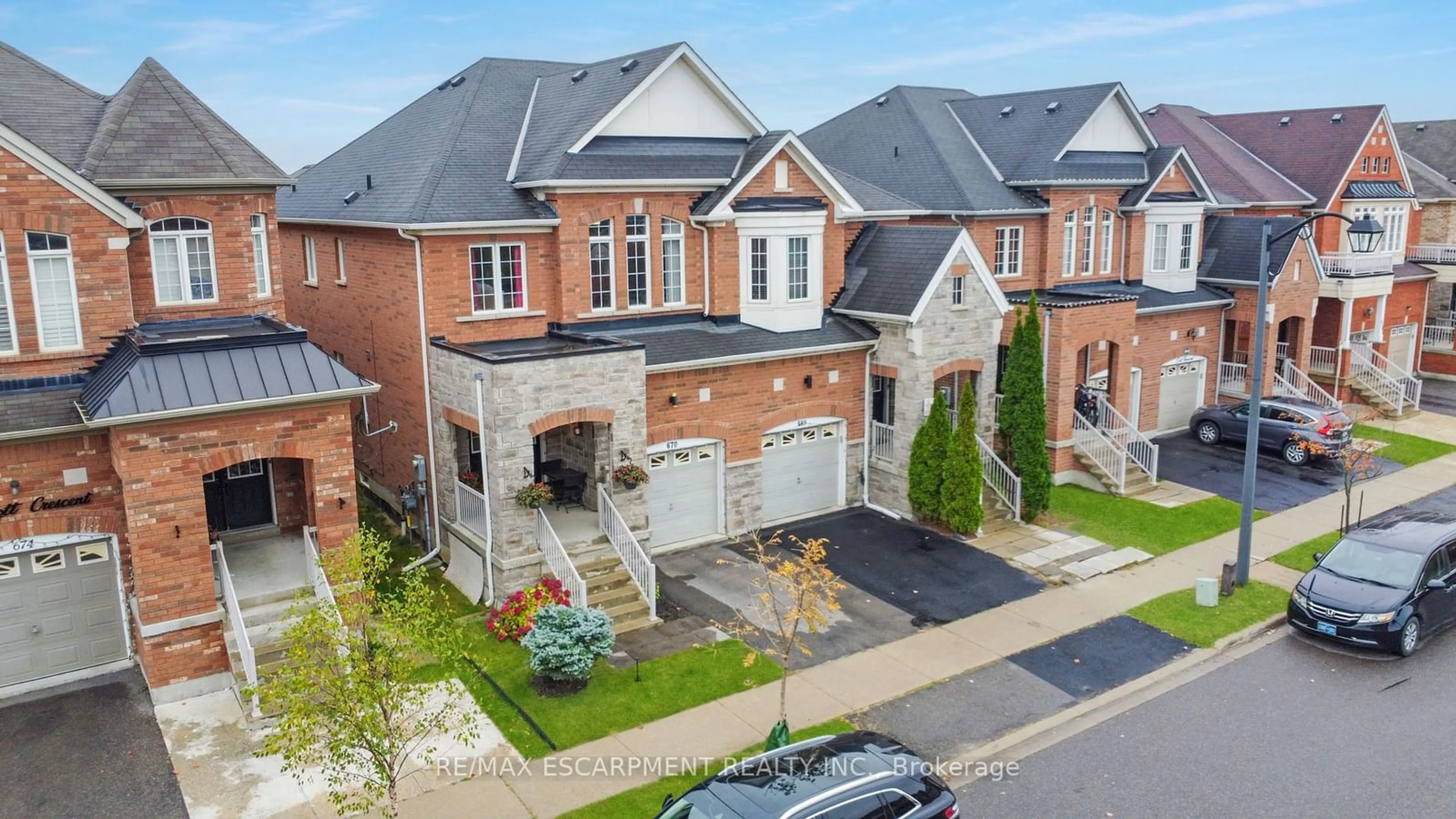 A pic from exterior of the house or condo, the street view for 670 Lott Cres, Milton Ontario L9T 7P6