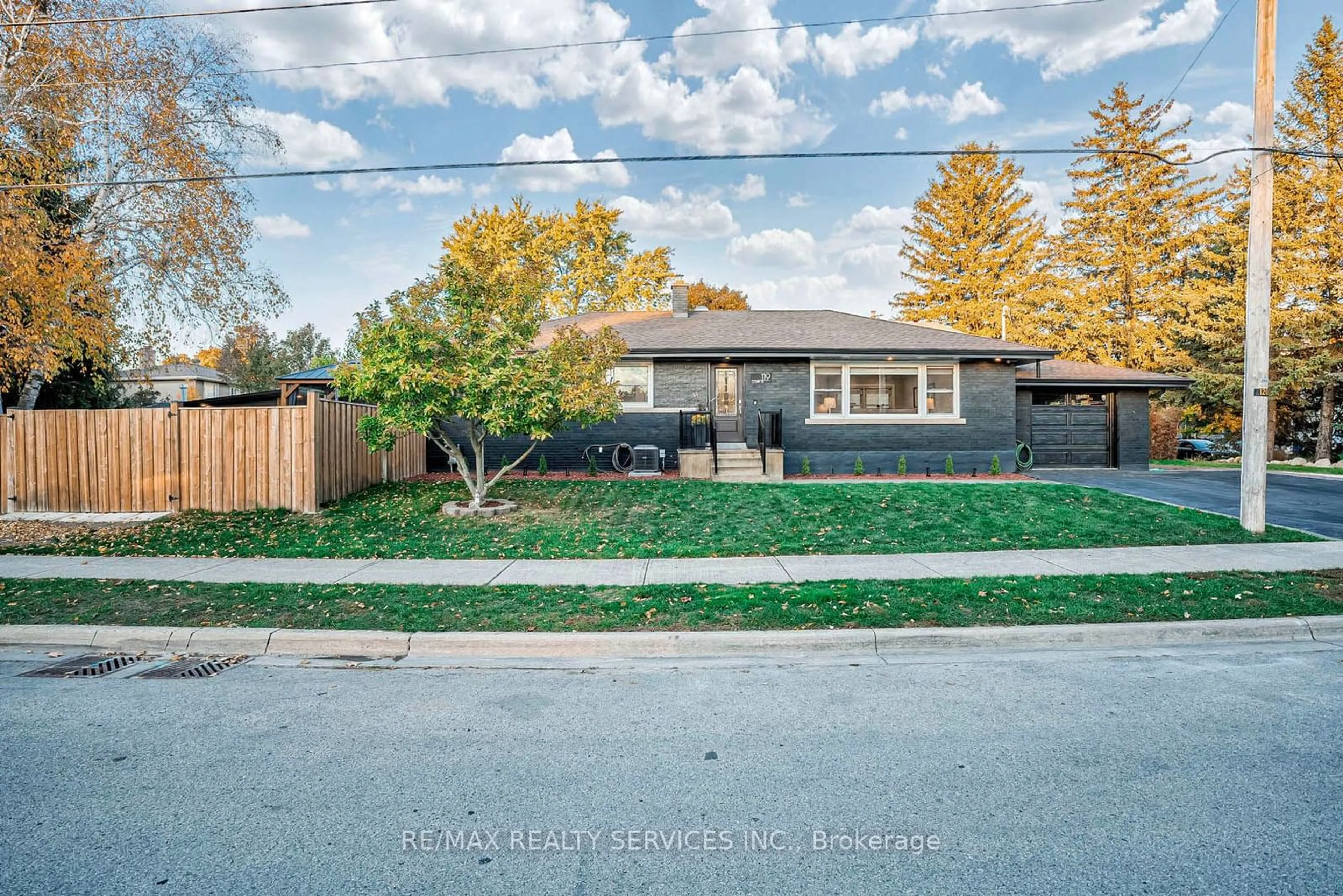 Frontside or backside of a home, the fenced backyard for 119 Court St, Milton Ontario L9T 2S5