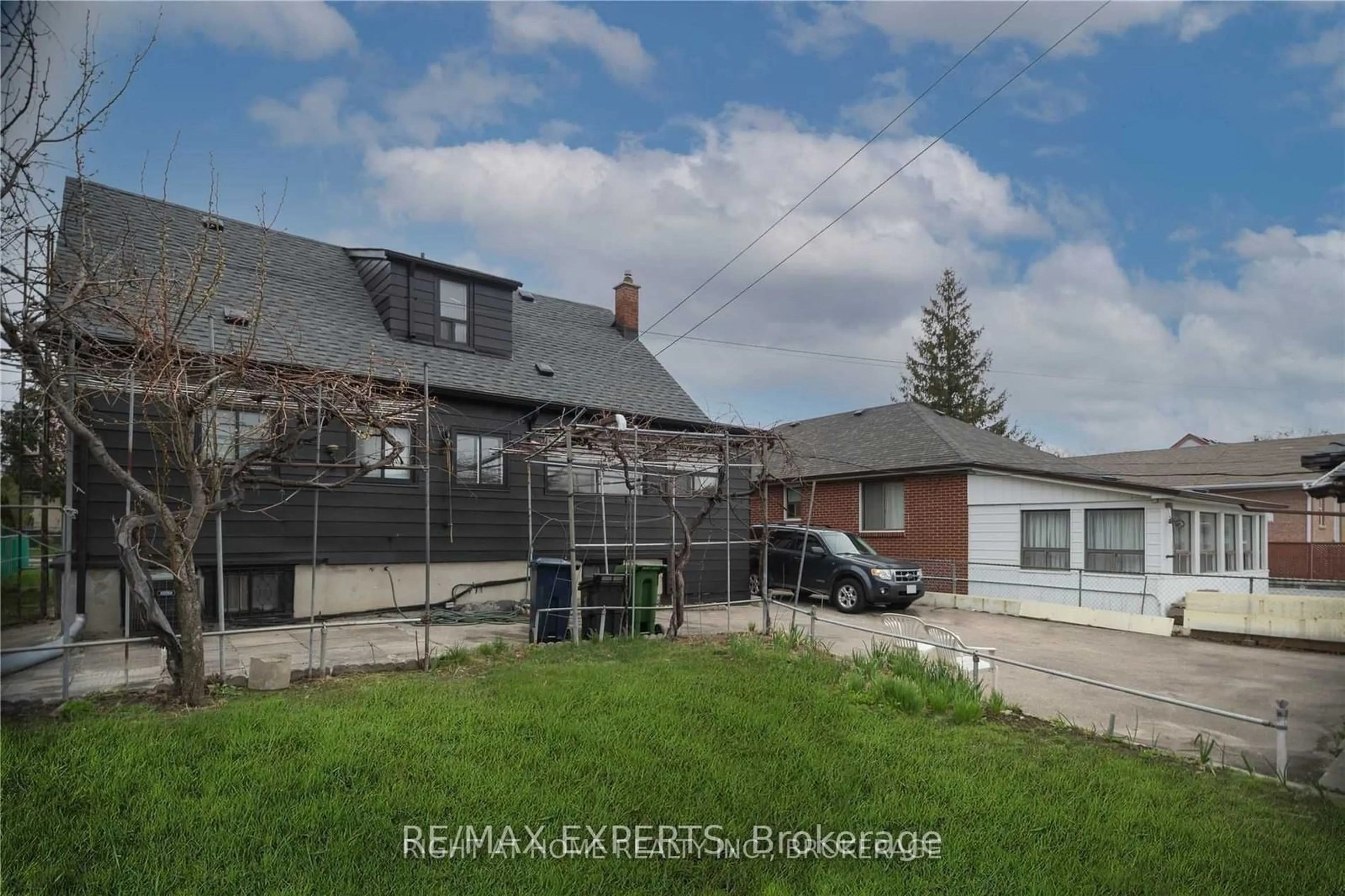 Frontside or backside of a home, the fenced backyard for 1010 Caledonia Rd, Toronto Ontario M6B 3Z1