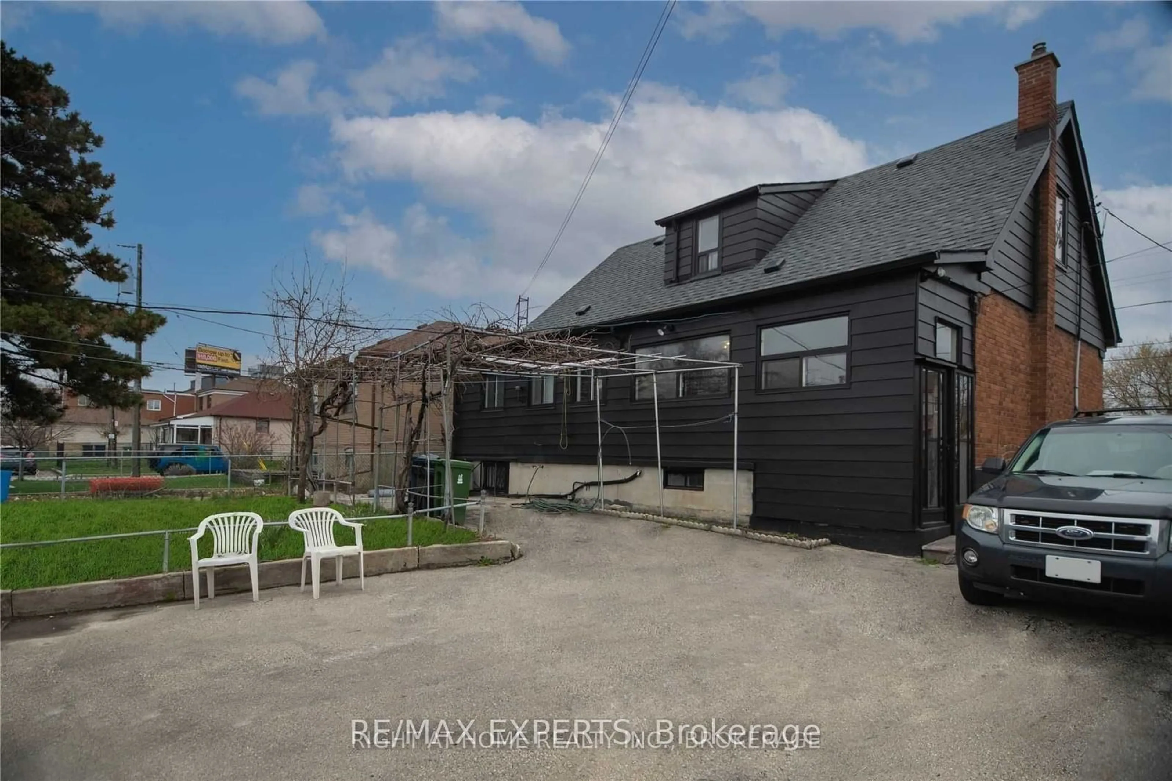 Frontside or backside of a home, the fenced backyard for 1010 Caledonia Rd, Toronto Ontario M6B 3Z1