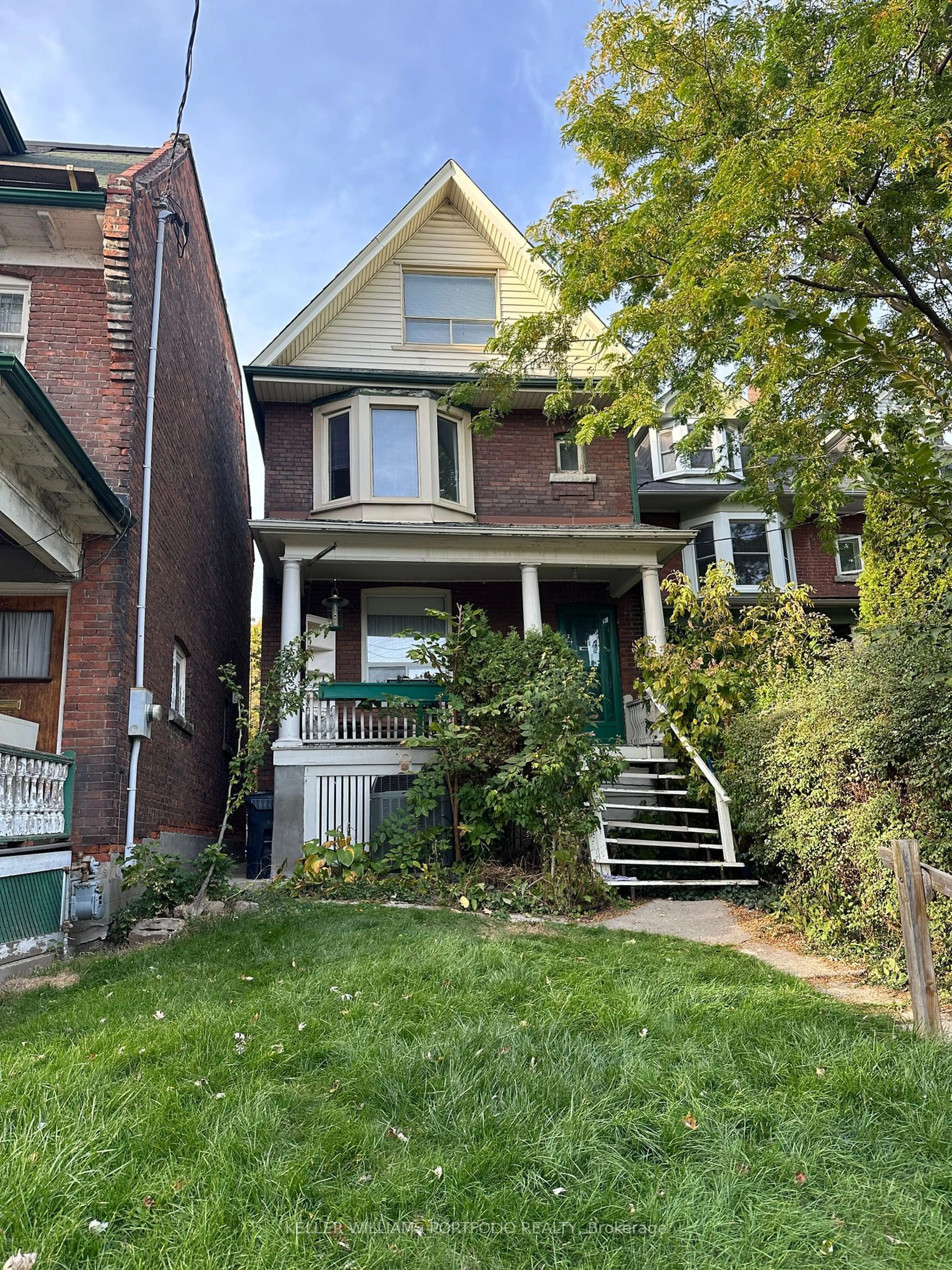 Frontside or backside of a home, the street view for 248 Garden Ave, Toronto Ontario M6R 1J3