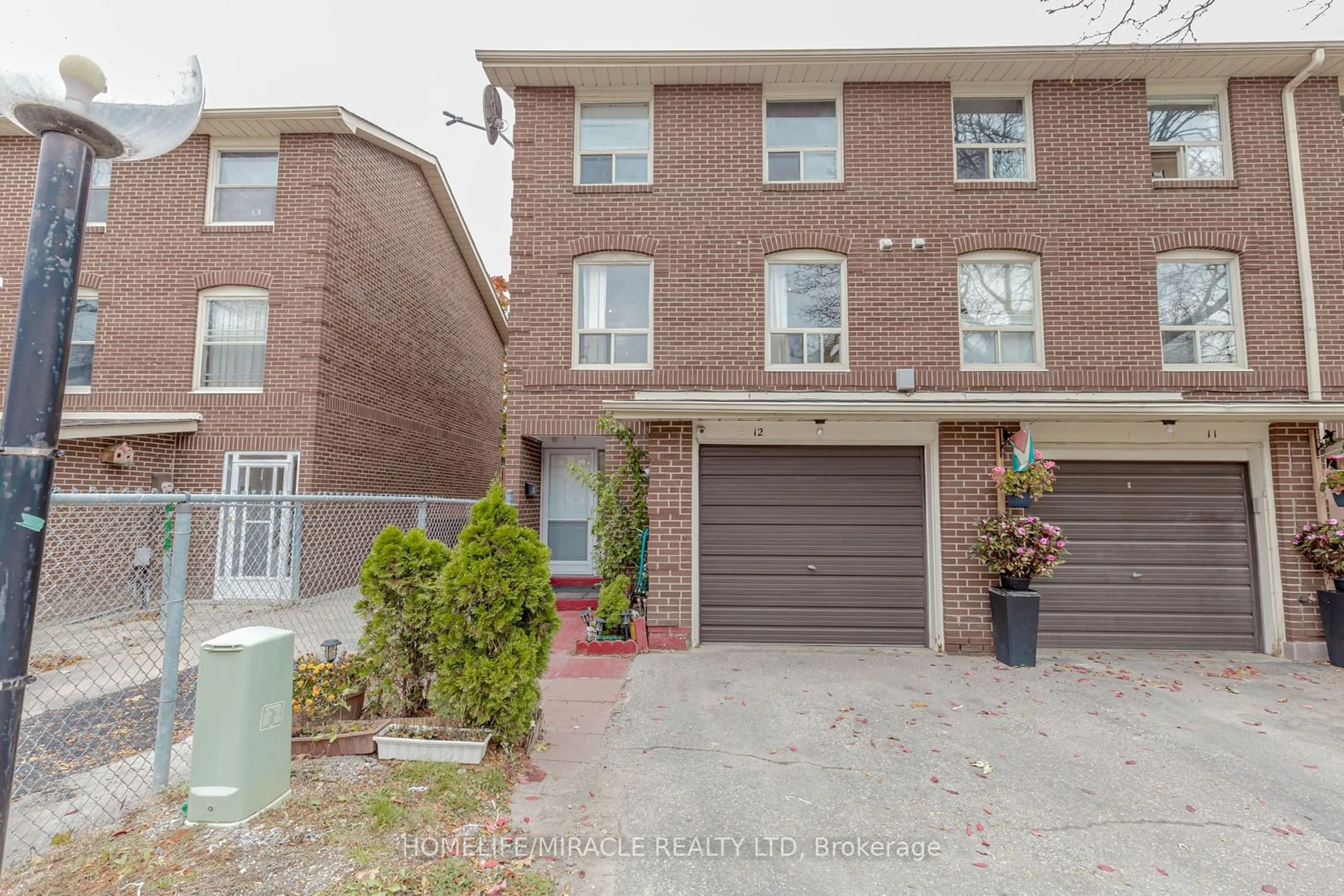 A pic from exterior of the house or condo, the street view for 12 Eden Park #12, Brampton Ontario L6T 3A5