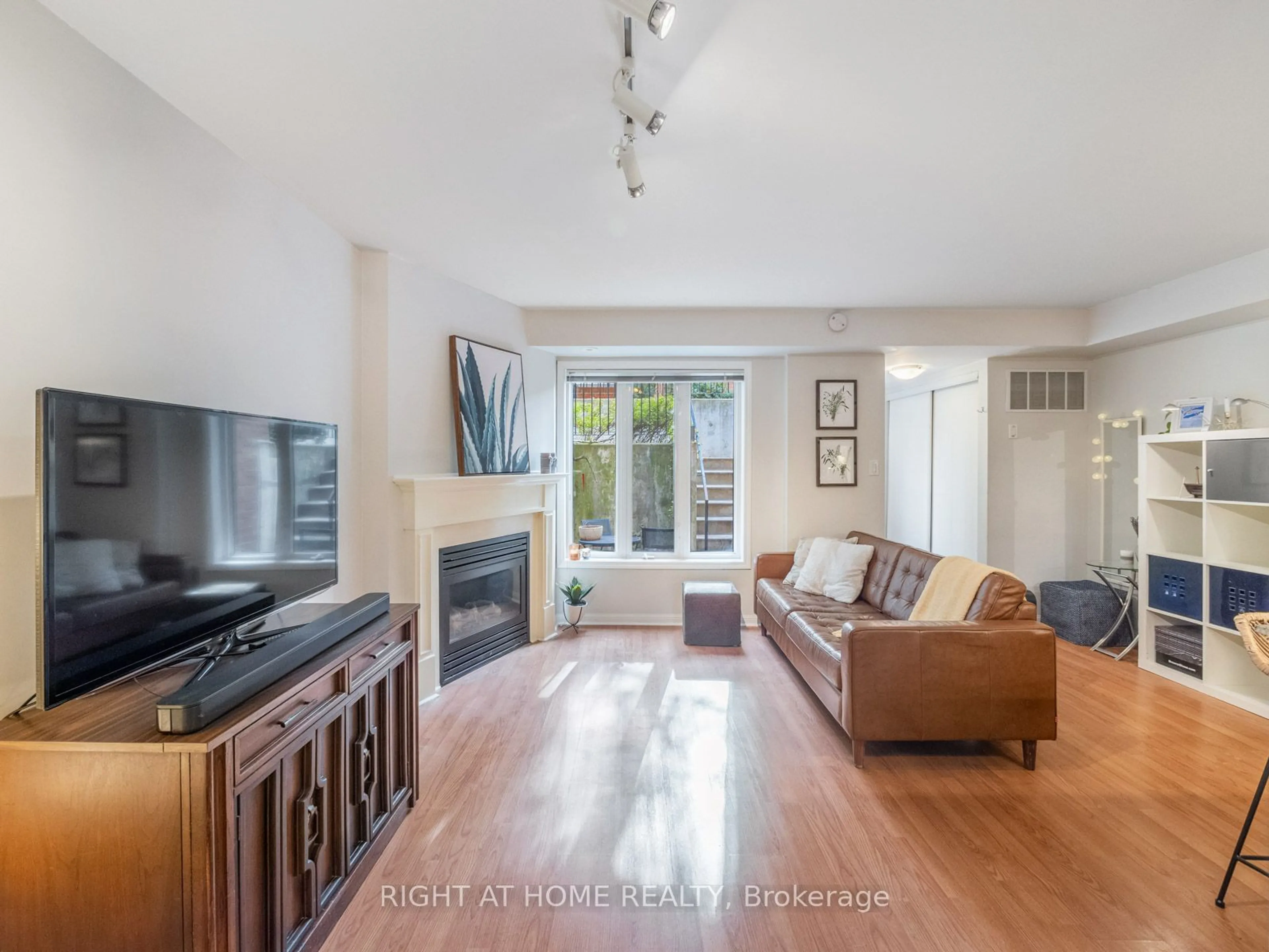 Living room, wood floors for 26 Laidlaw St #1533, Toronto Ontario M6K 1X2