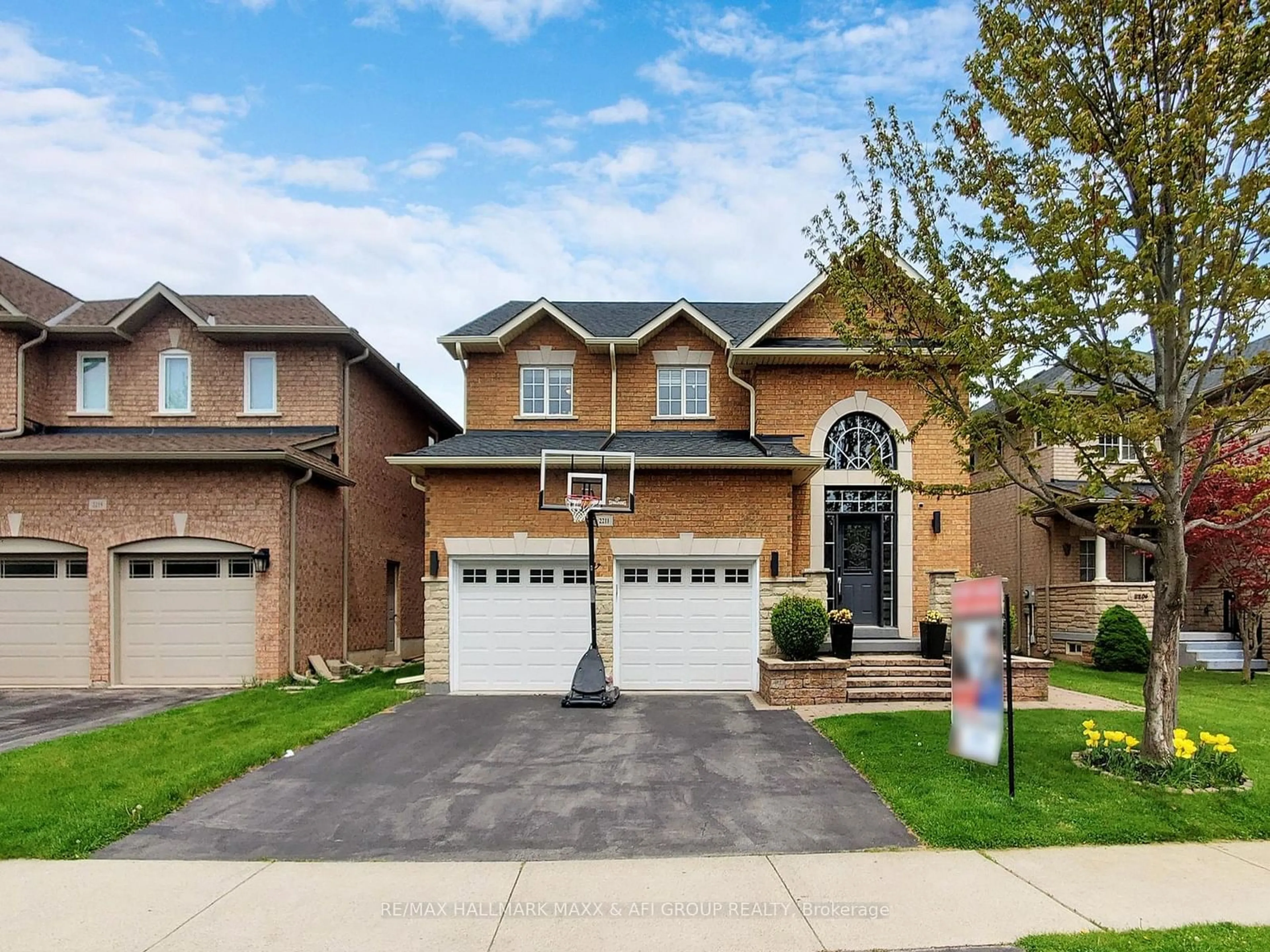 Frontside or backside of a home, the street view for 2211 Stratus Dr, Oakville Ontario L6M 4W5