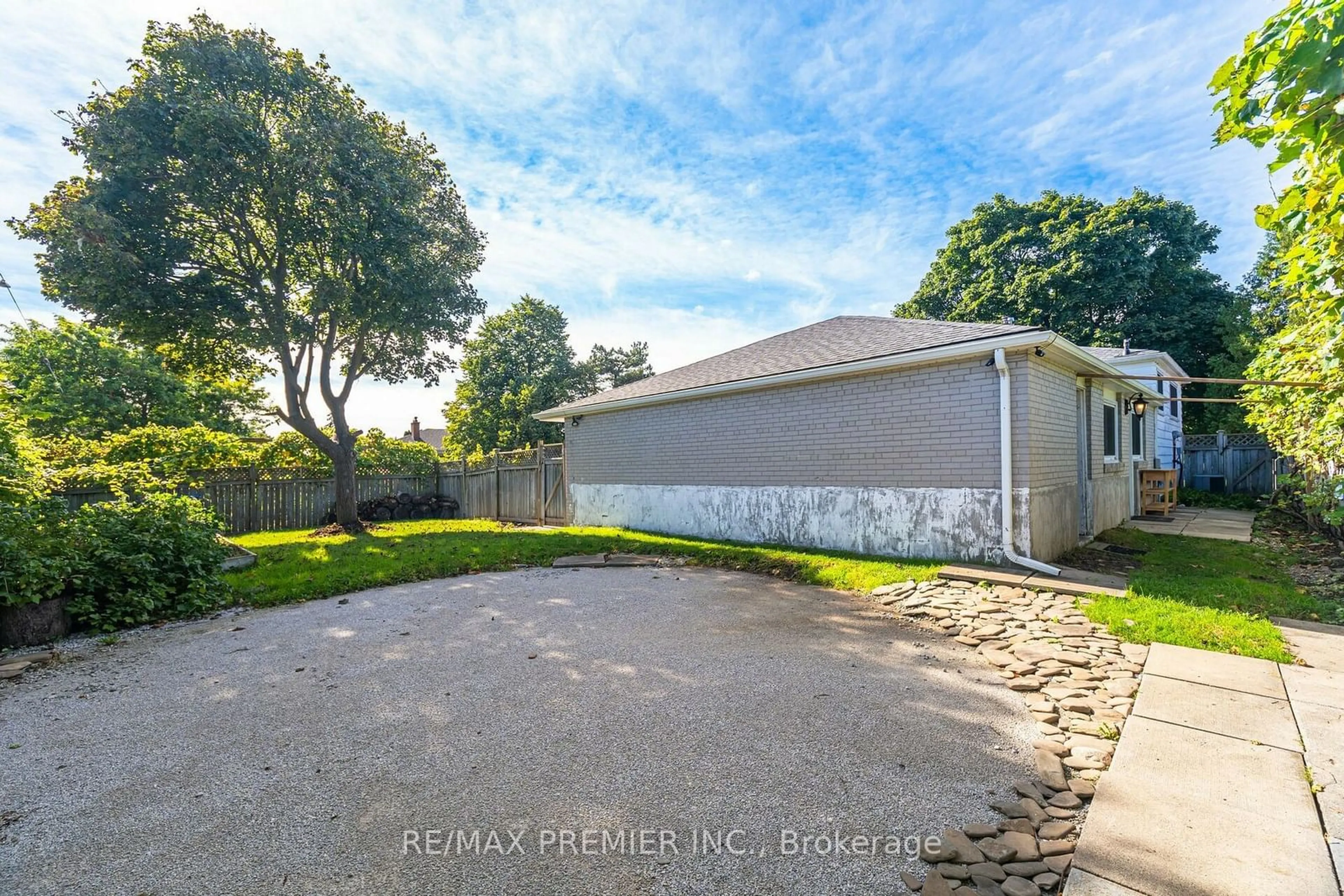 Frontside or backside of a home, the fenced backyard for 164 Avondale Blvd, Brampton Ontario L6T 1J2