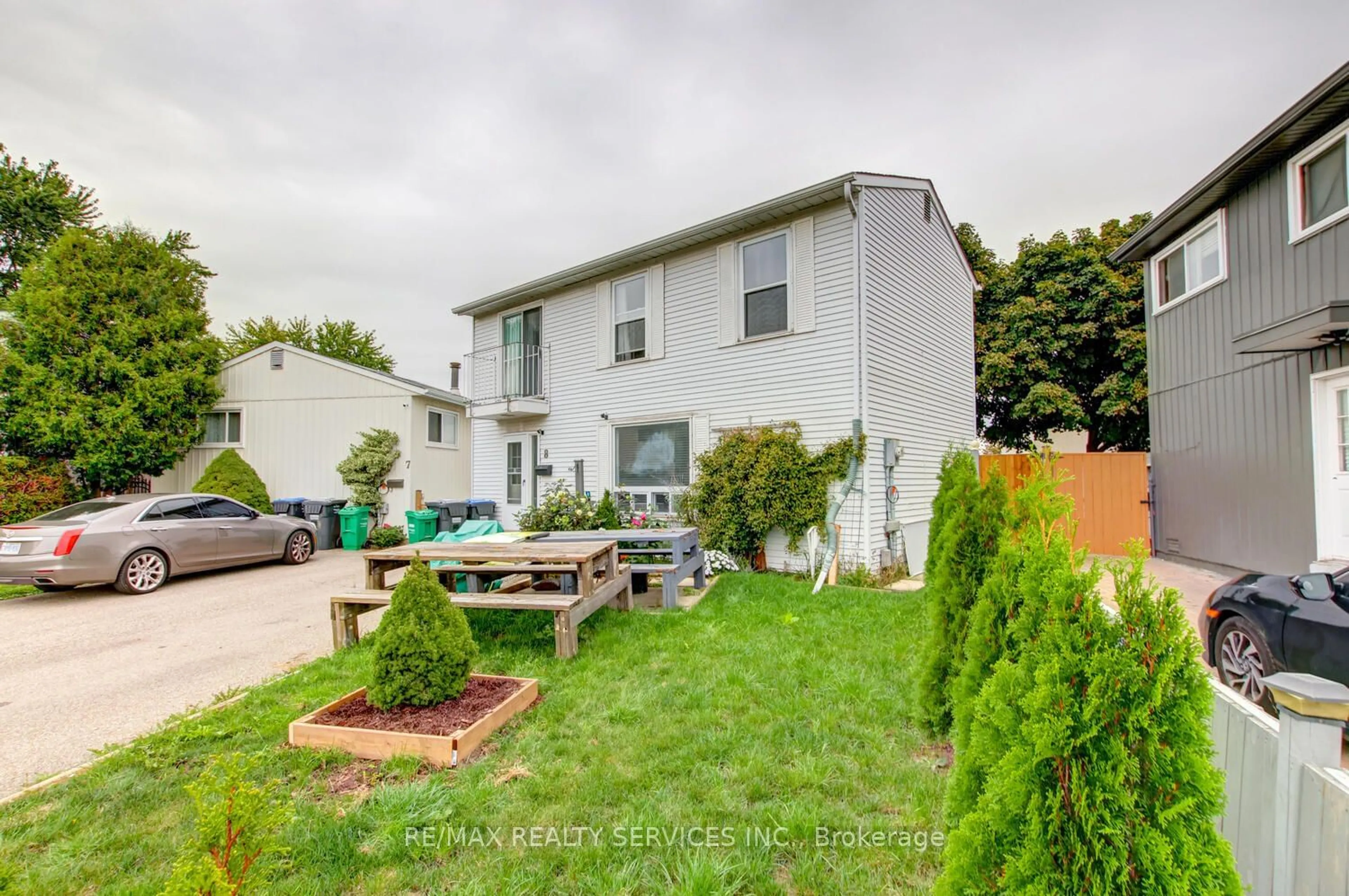 A pic from exterior of the house or condo, the fenced backyard for 8 Heatherside Crt, Brampton Ontario L6S 1N9