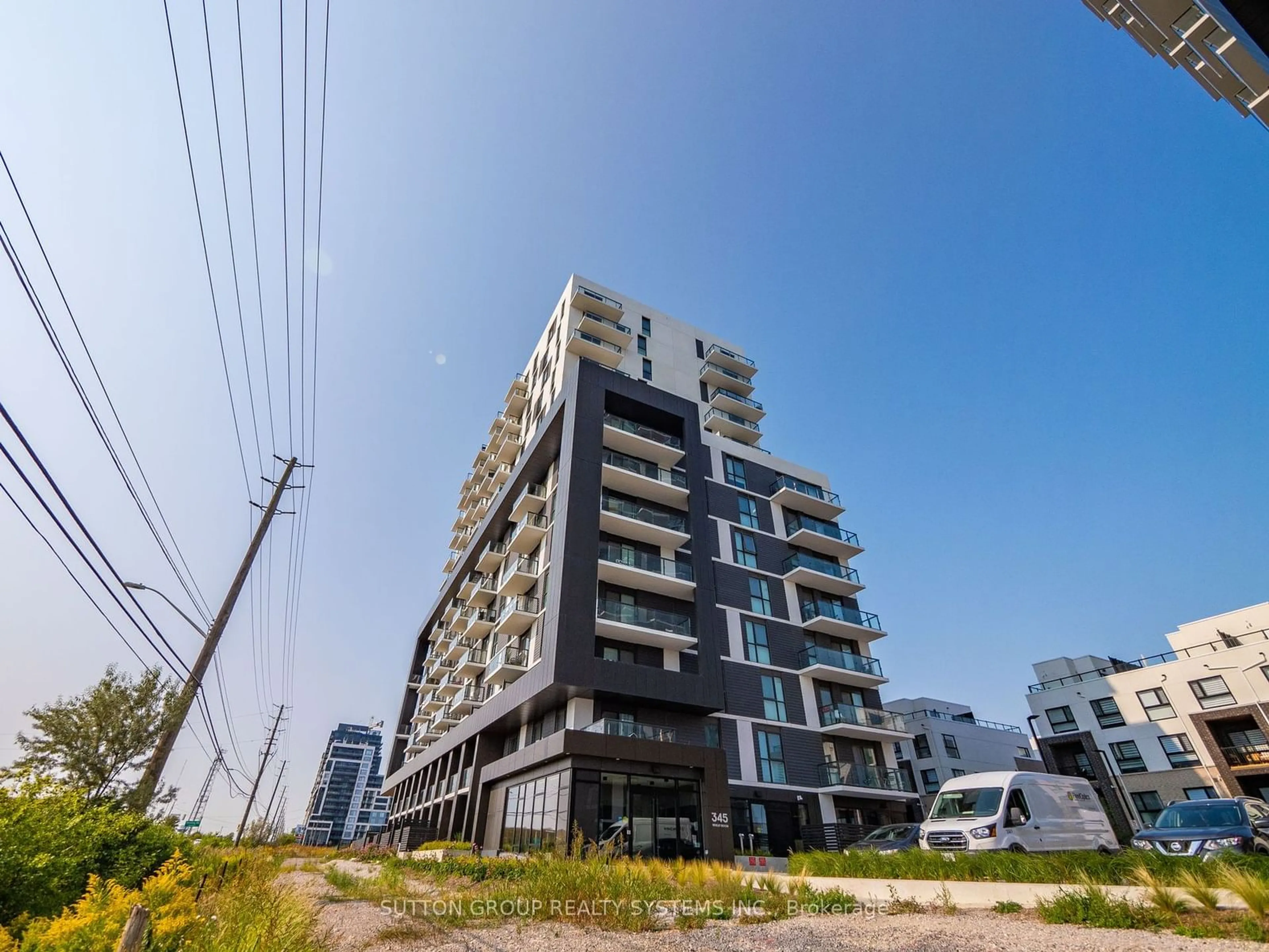 A pic from exterior of the house or condo, the street view for 345 Wheat Boom Dr #413, Oakville Ontario L6H 7X4