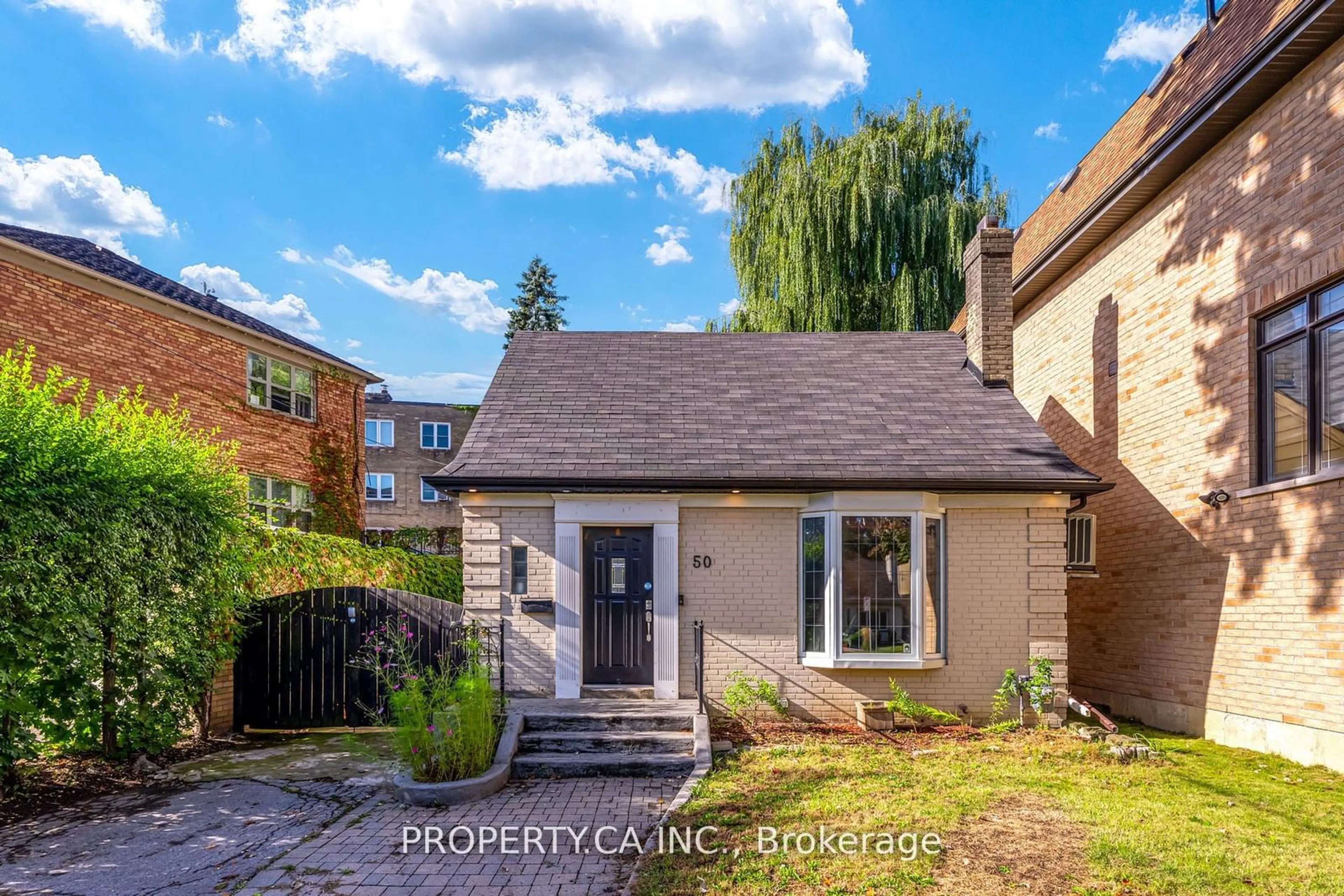 Frontside or backside of a home, the fenced backyard for 50 South Kingsway, Toronto Ontario M6S 3T3