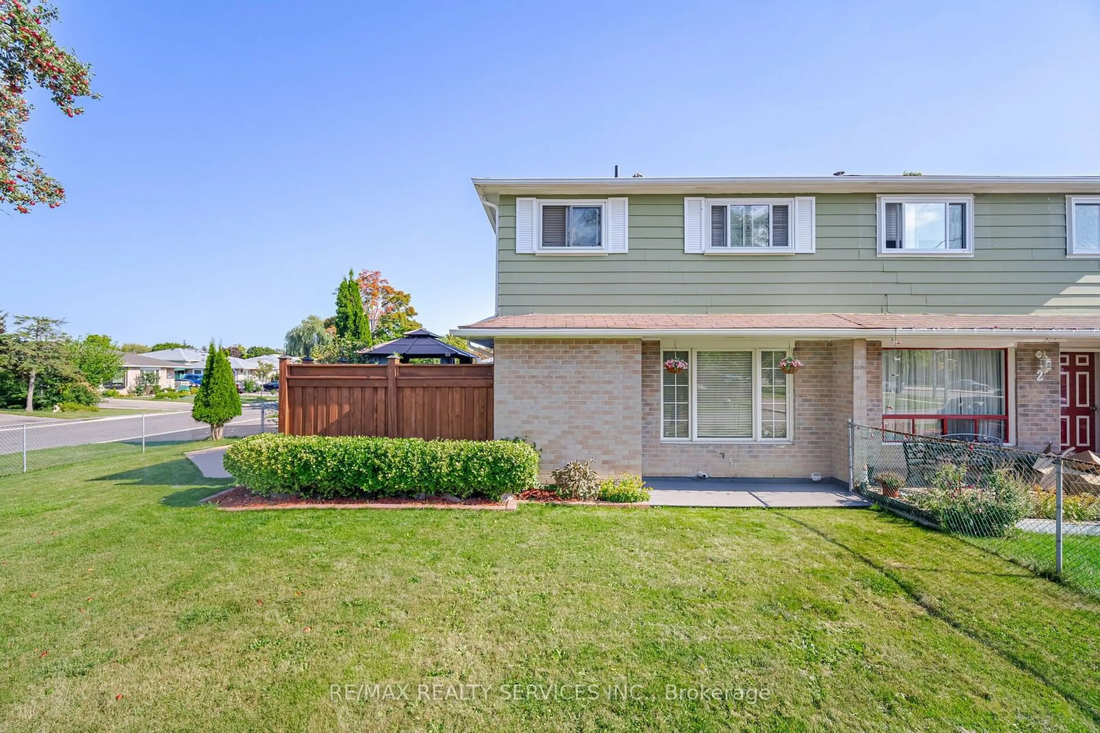 A pic from exterior of the house or condo, the fenced backyard for 97 Juniper Cres, Brampton Ontario L6S 1J9