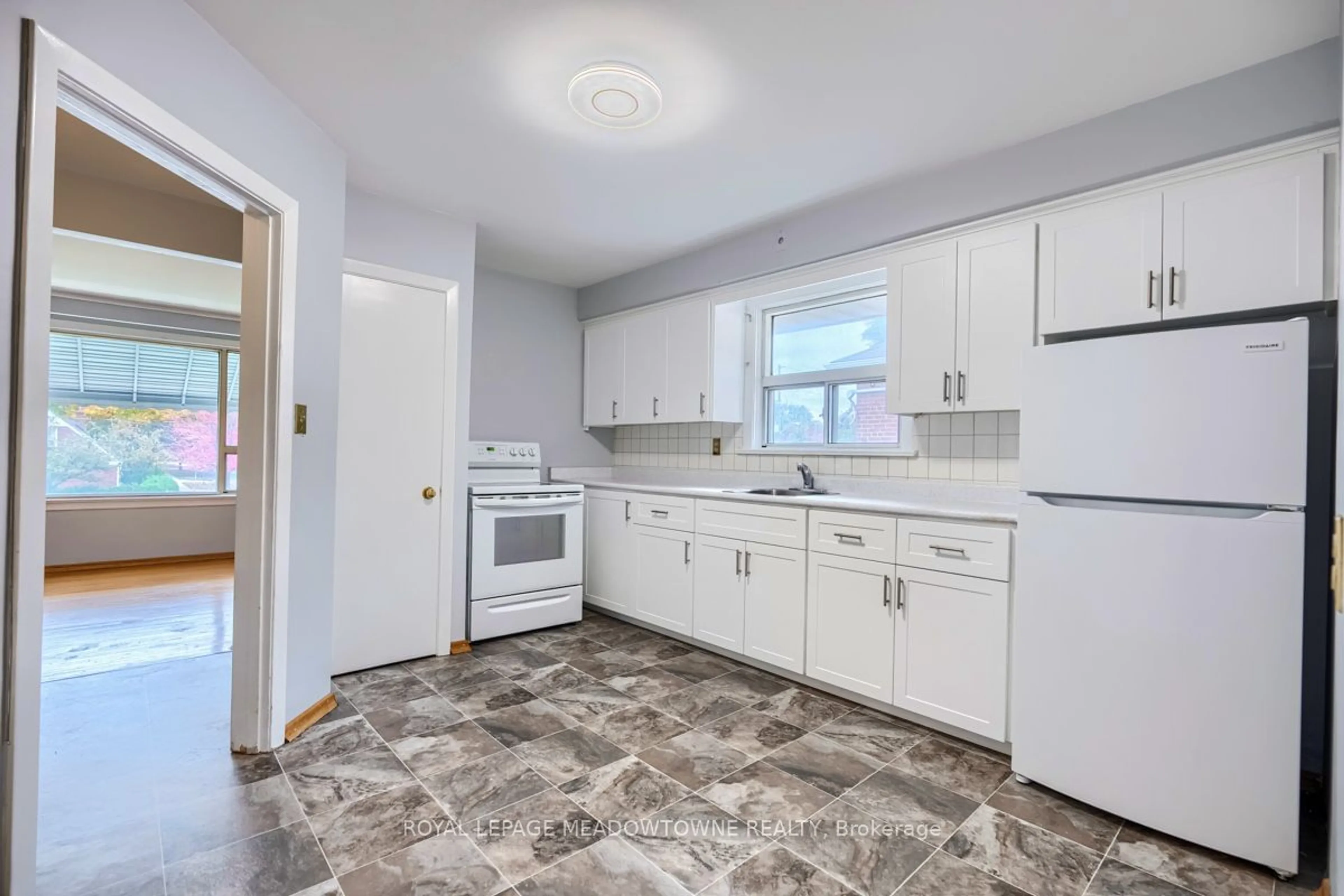 Standard kitchen, wood floors, cottage for 671 Browns Line, Toronto Ontario M8W 3V7