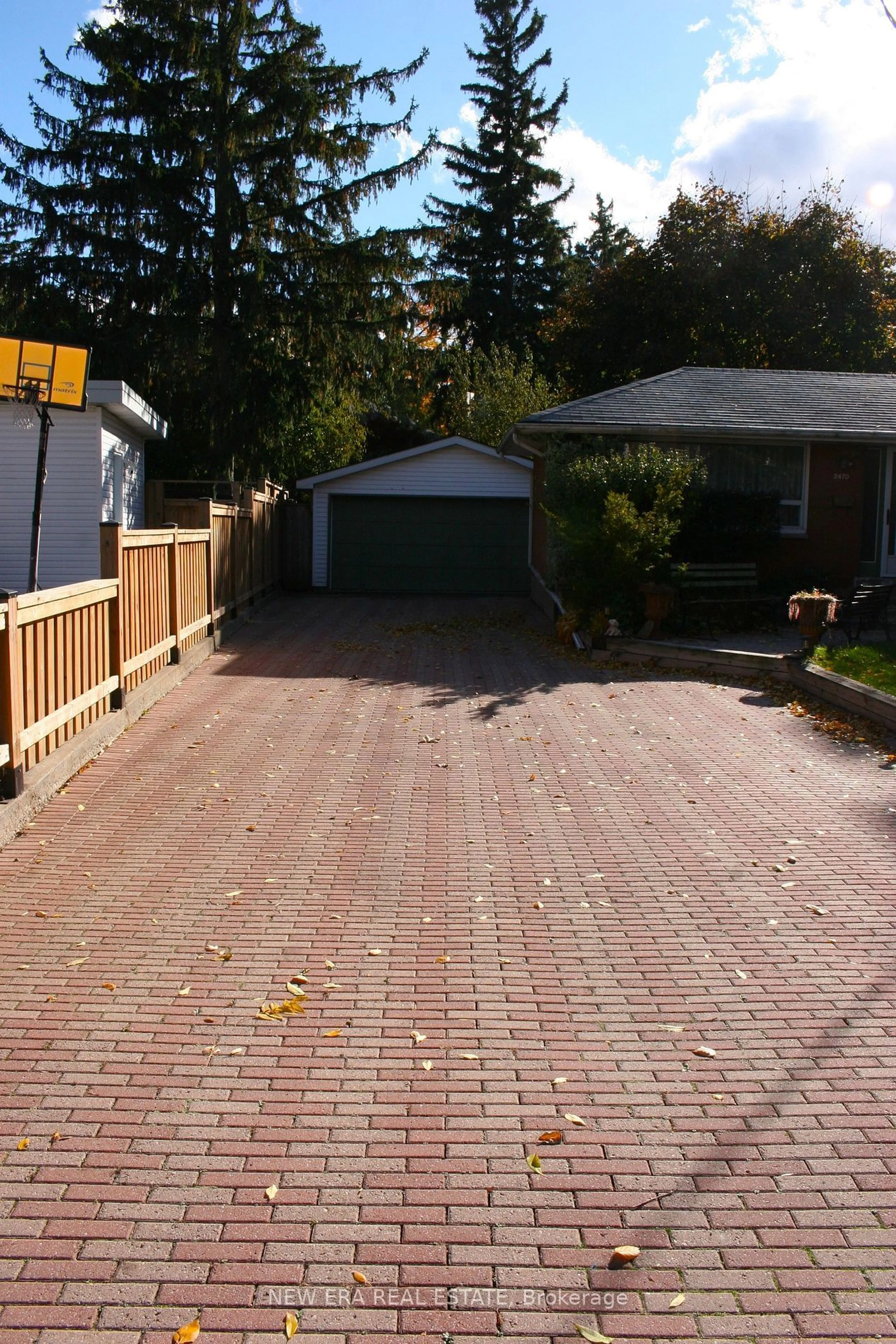 Frontside or backside of a home, the fenced backyard for 2470 Meadowood Cres, Oakville Ontario L6L 1V6