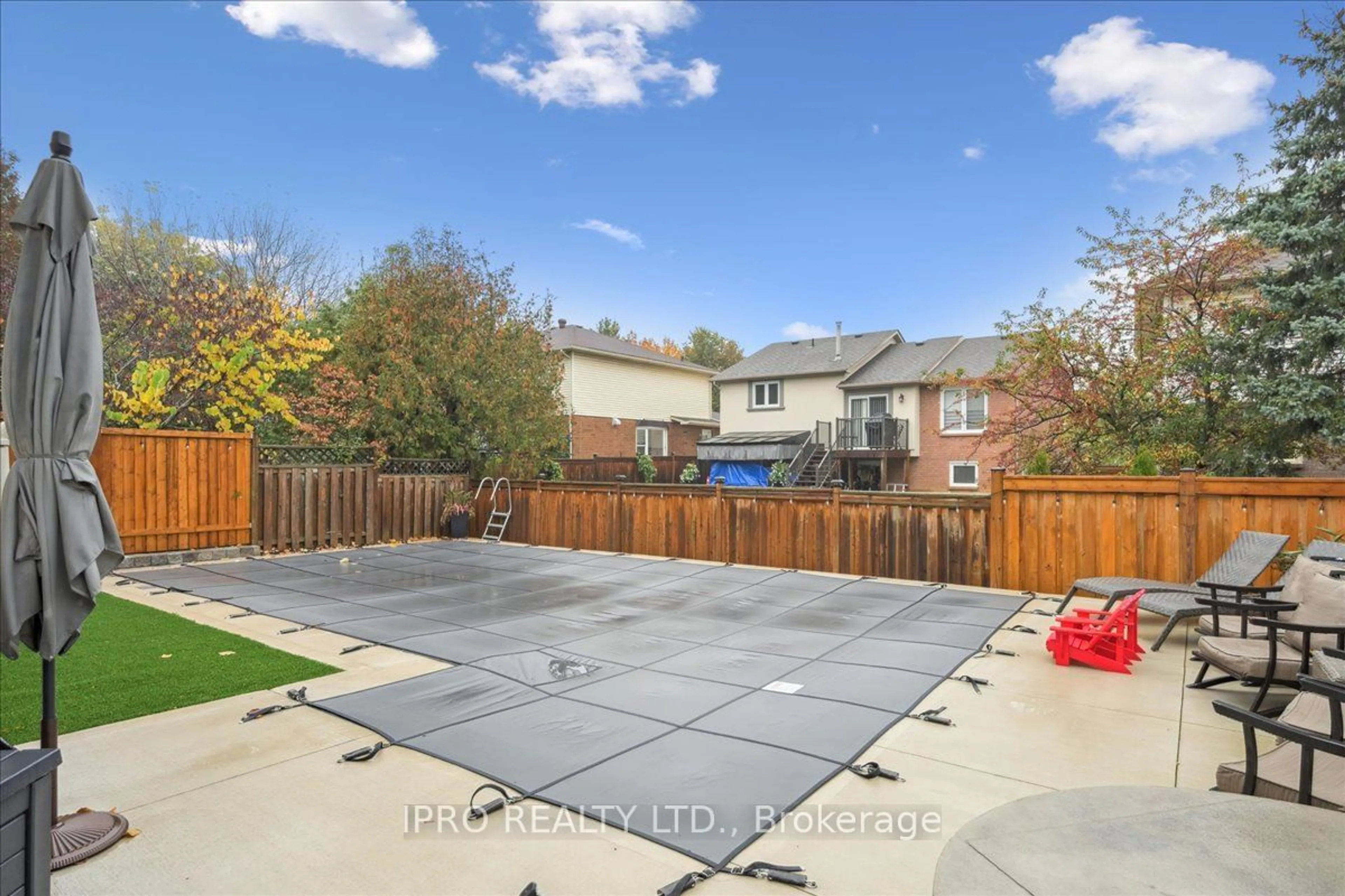 Frontside or backside of a home, the fenced backyard for 2153 Marc Lane, Burlington Ontario L7M 3W6