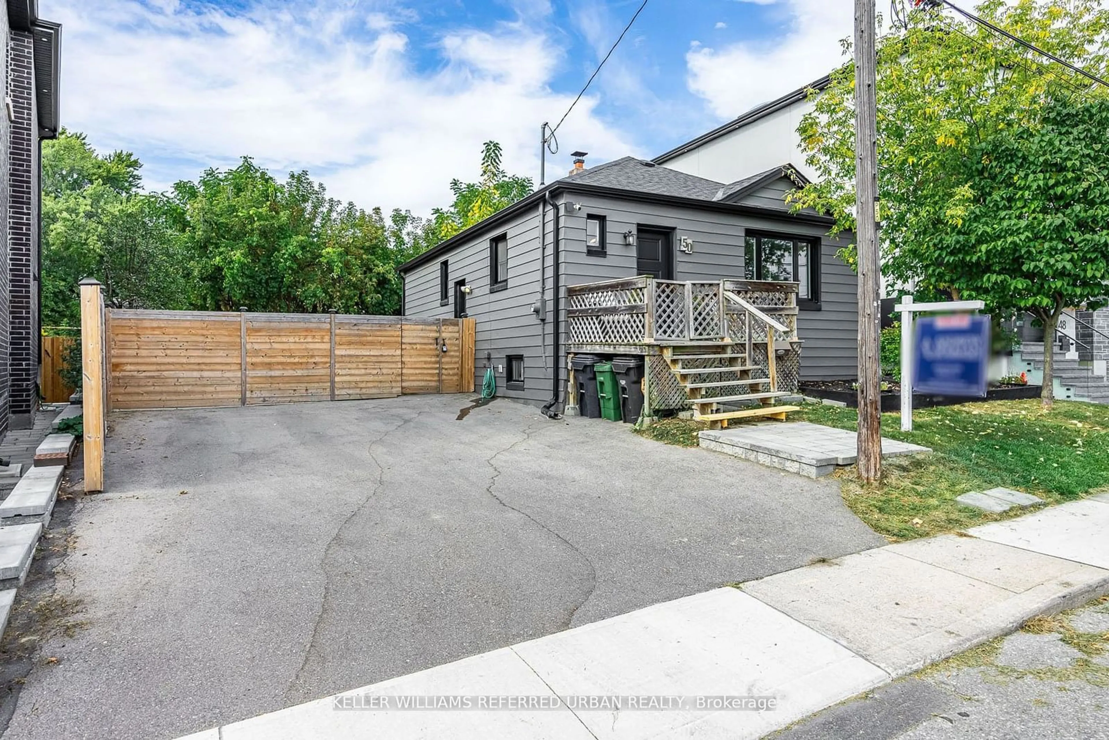 Frontside or backside of a home, the fenced backyard for 50 Exmoor Dr, Toronto Ontario M9W 1R5