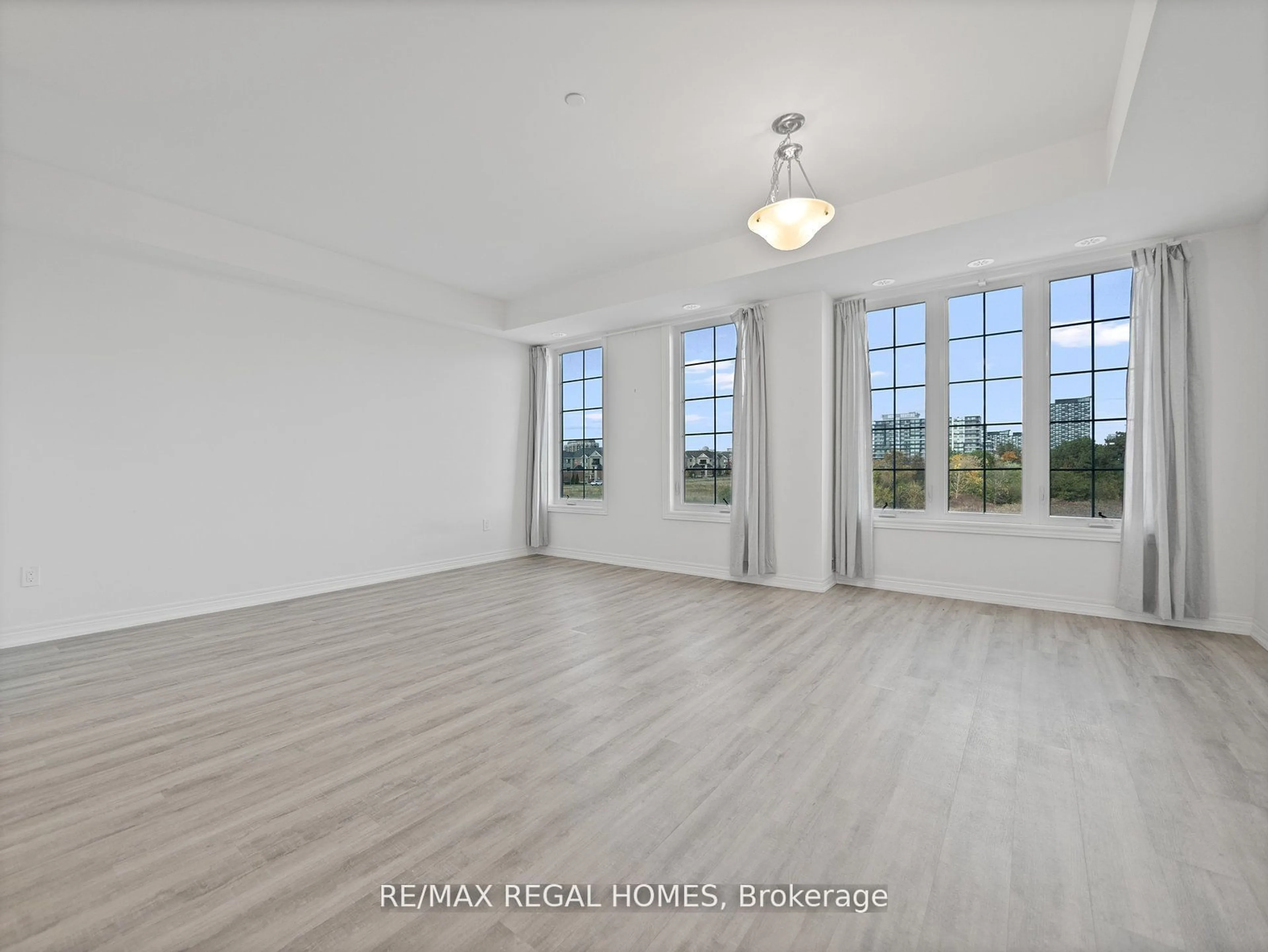 A pic of a room, wood floors for 2205 Lillykin St #3, Oakville Ontario L6H 7H2