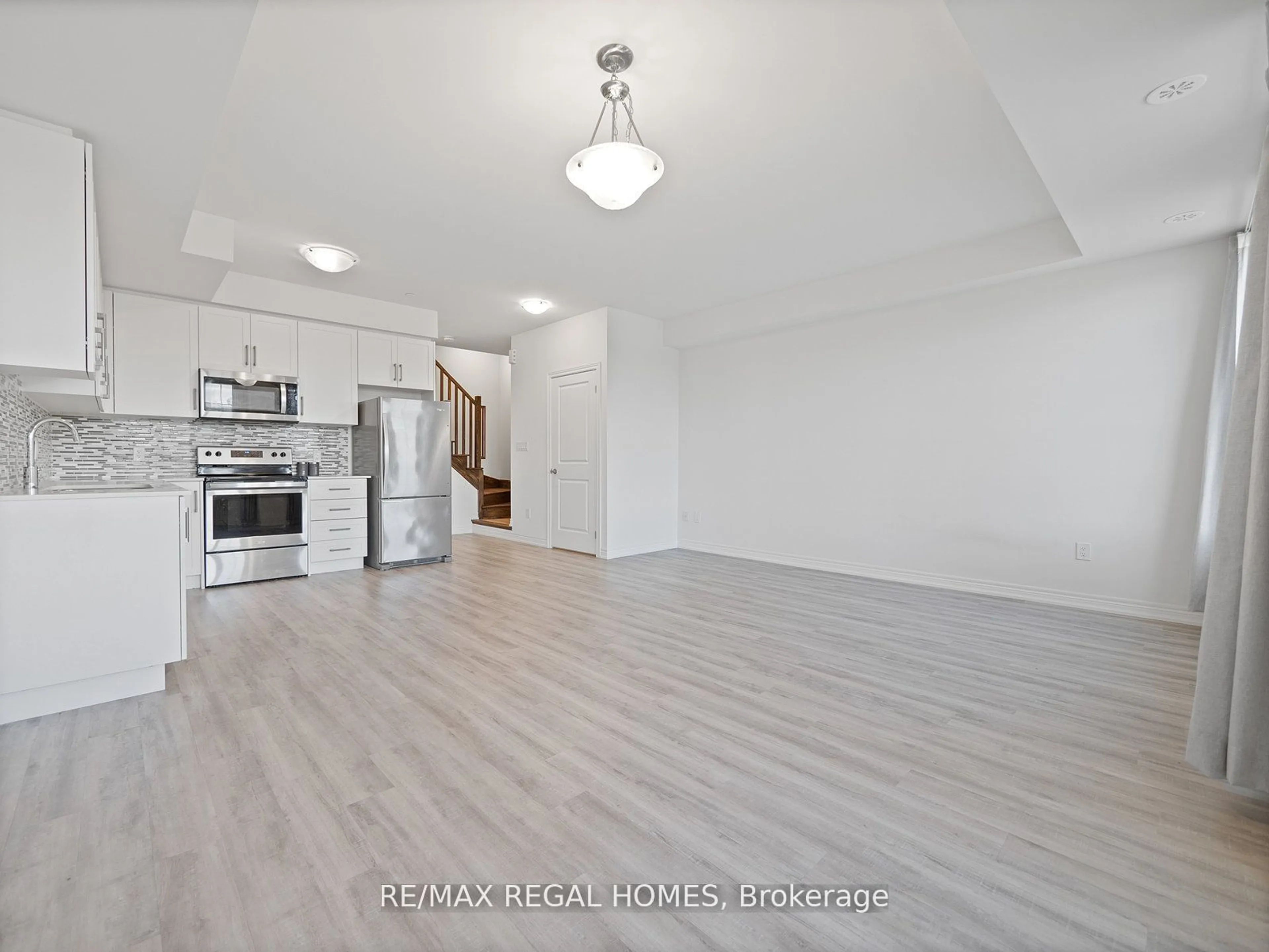 A pic of a room, wood floors for 2205 Lillykin St #3, Oakville Ontario L6H 7H2