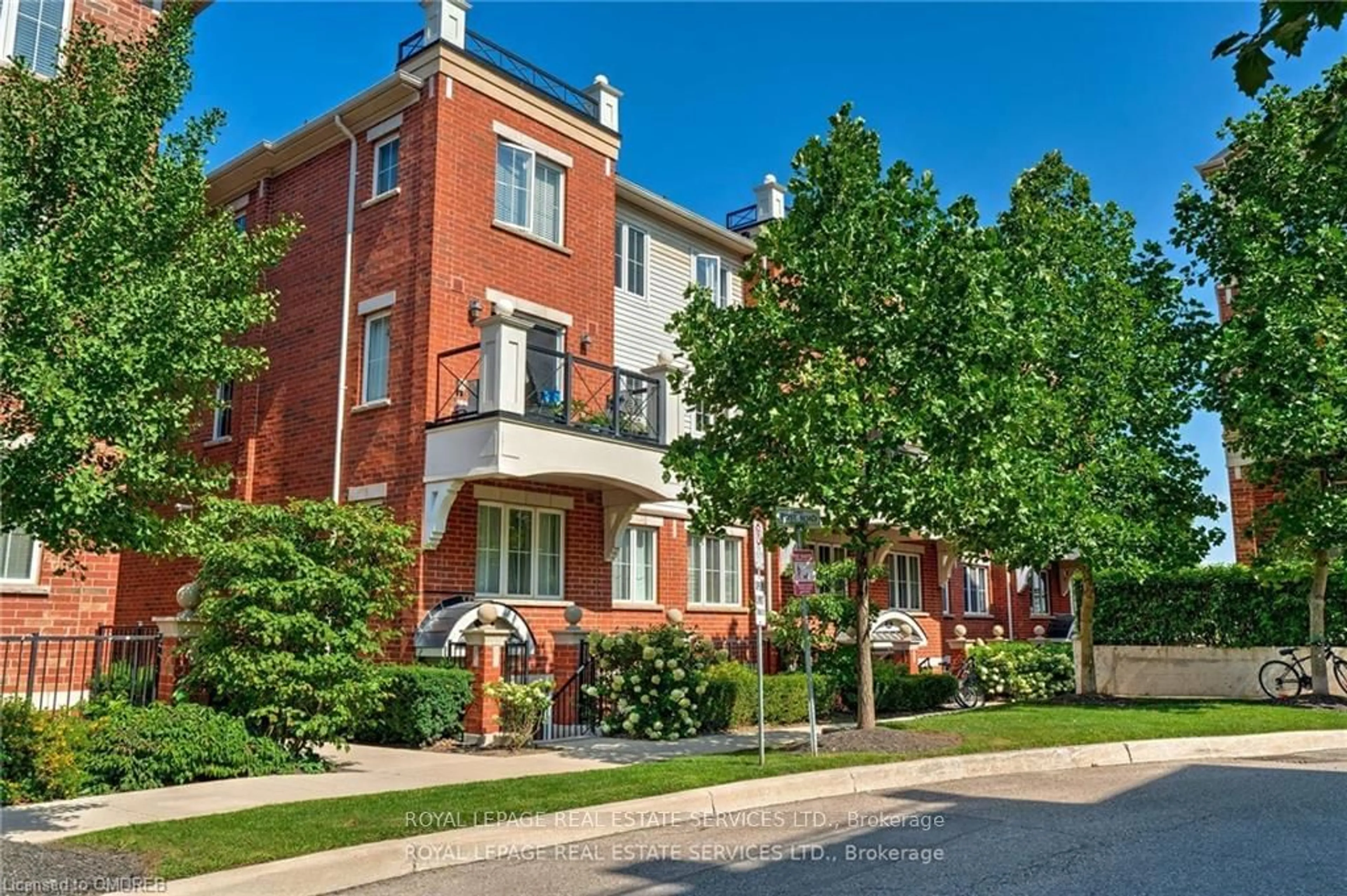 A pic from exterior of the house or condo, the street view for 2460 Post Rd #20, Oakville Ontario L6H 0J2