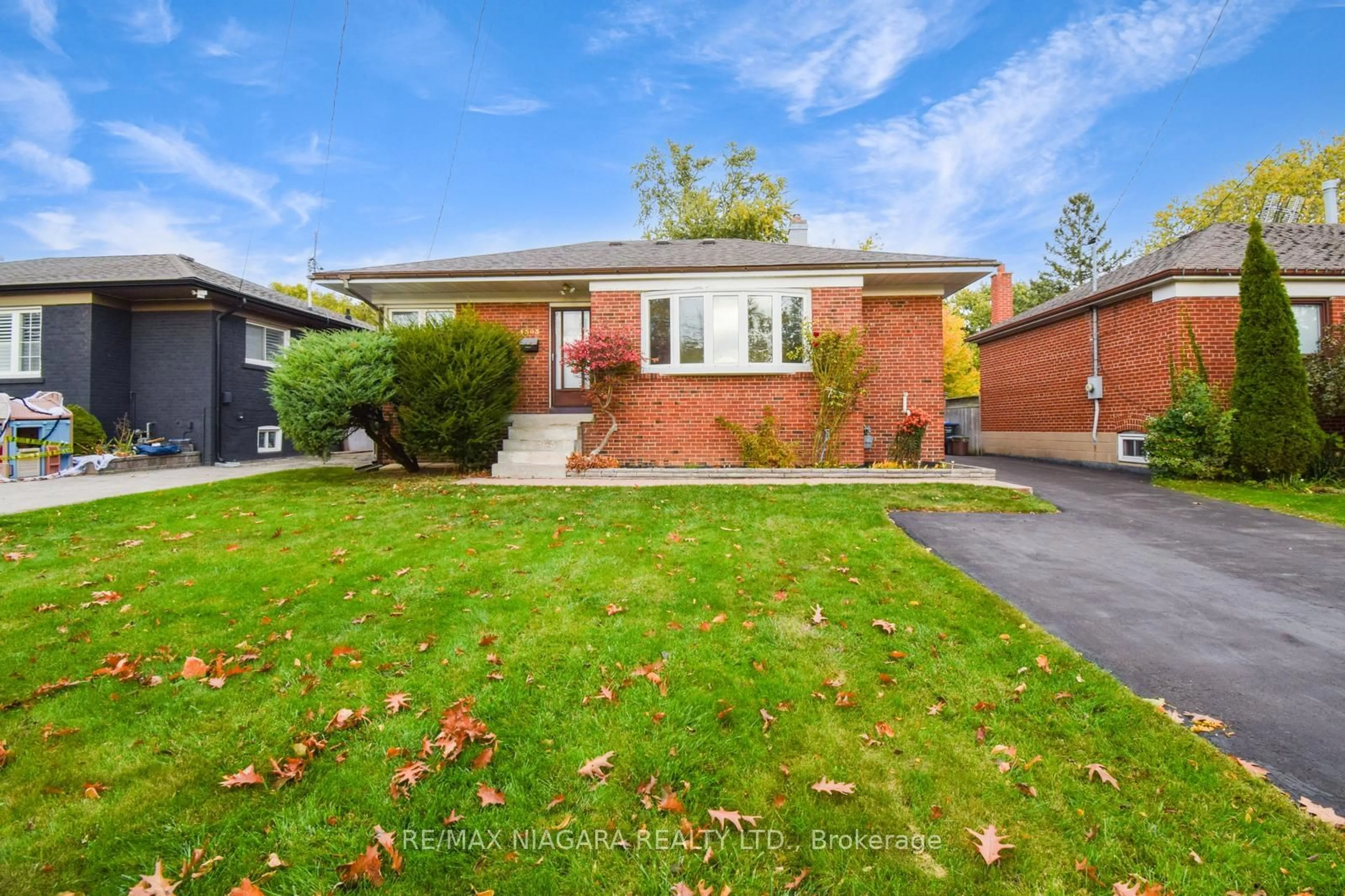 Frontside or backside of a home, the fenced backyard for 1503 Blanefield Rd, Mississauga Ontario L5G 4H3