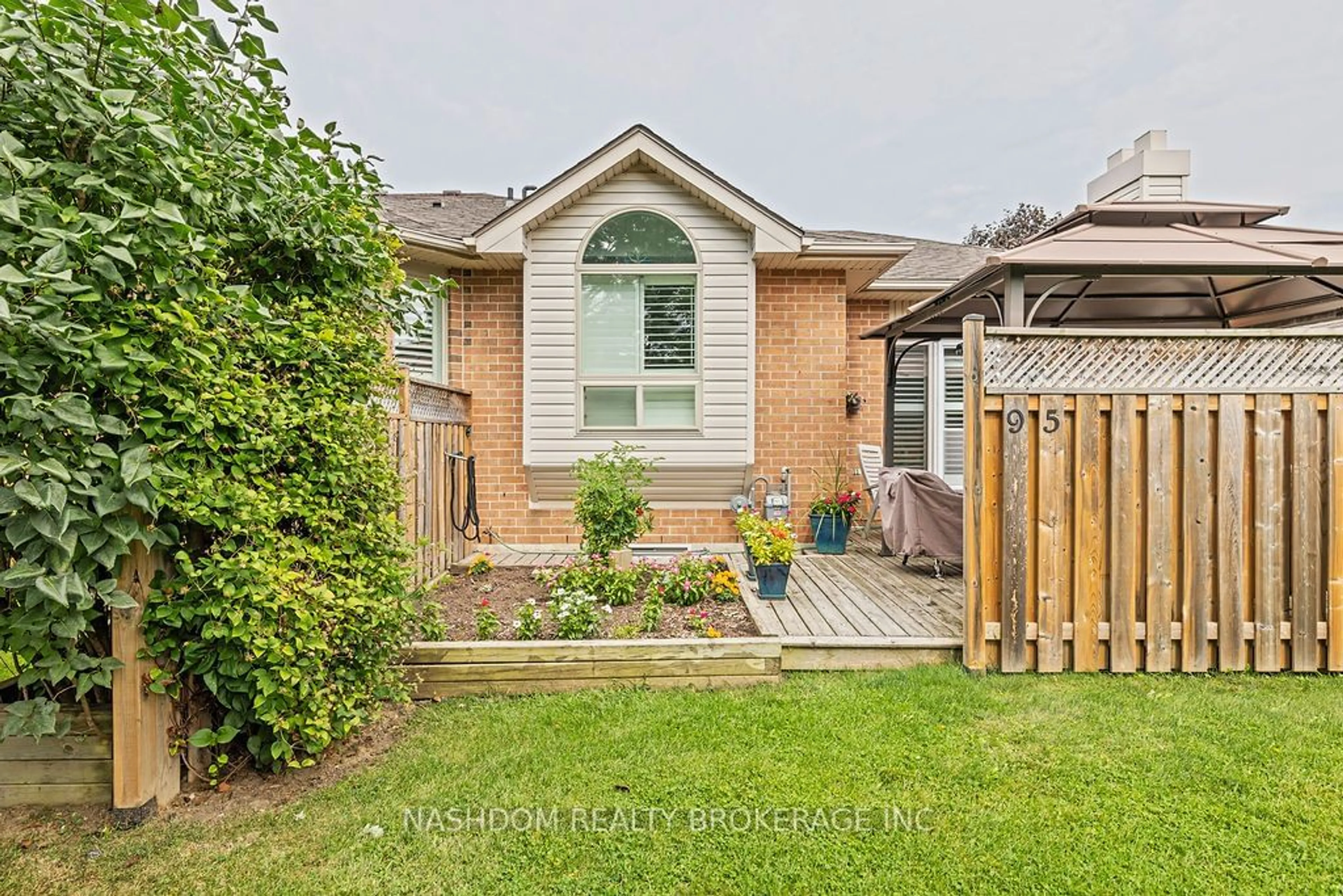 Frontside or backside of a home, the fenced backyard for 95 Starfish Dr #37, Hamilton Ontario L0R 1W0