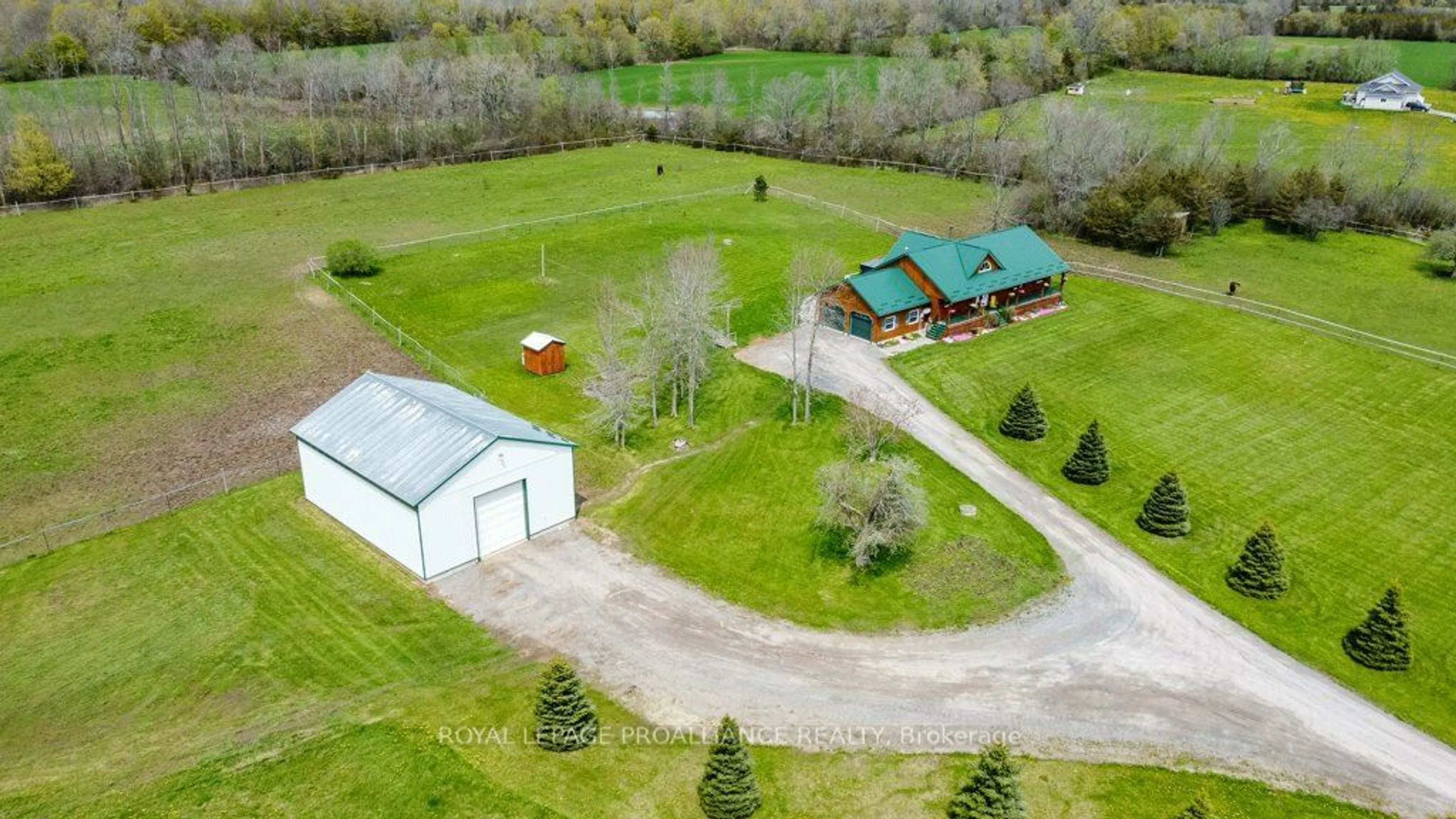 A pic from exterior of the house or condo, the fenced backyard for 1024 County Road 19, Prince Edward County Ontario K0K 1A0