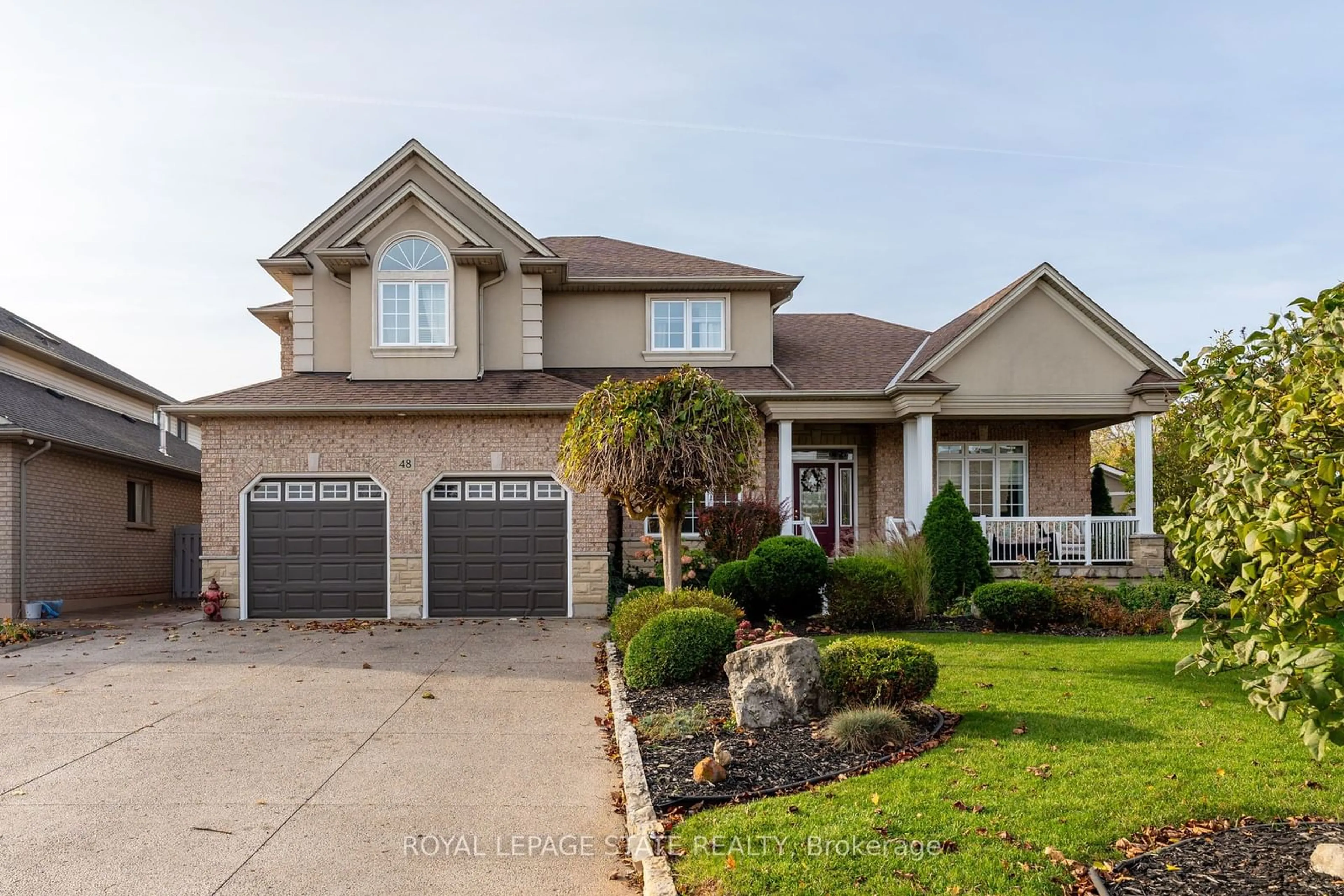 Frontside or backside of a home, the street view for 48 Tuscani Dr, Hamilton Ontario L8E 5W4